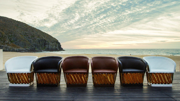Equipal chairs lined up in front of beach
