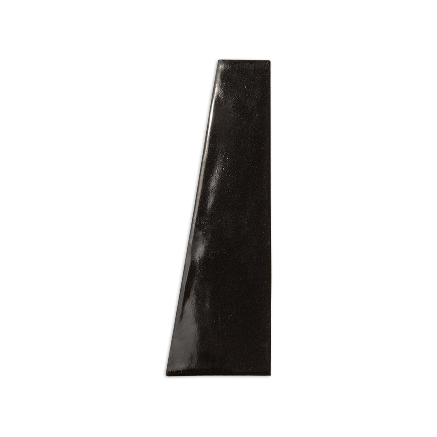Black, glossy Trumpet Grackle tile sample by Clay Imports, featuring a trapezoidal shape and subtle texture.