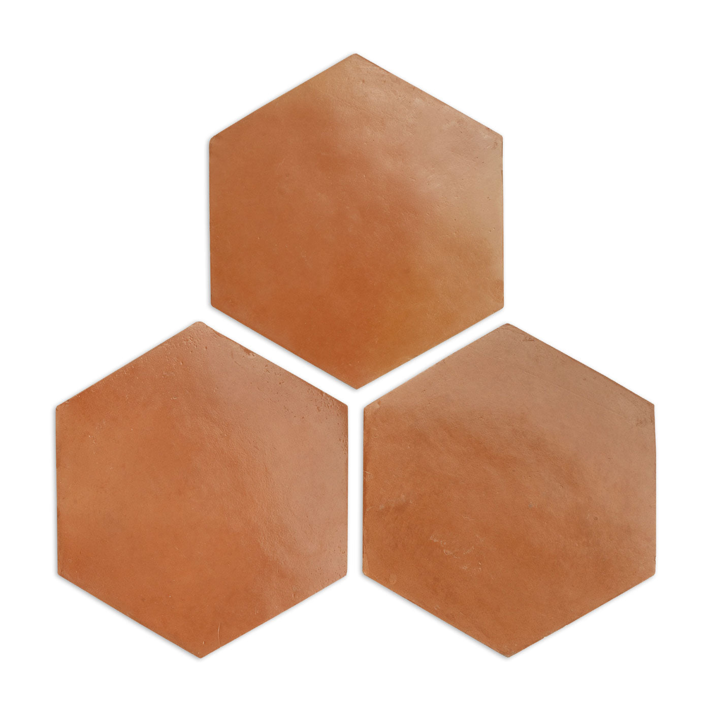 Three pressed terracotta red hexagon tile samples by Clay Imports, arranged in a cluster with a natural, matte finish.