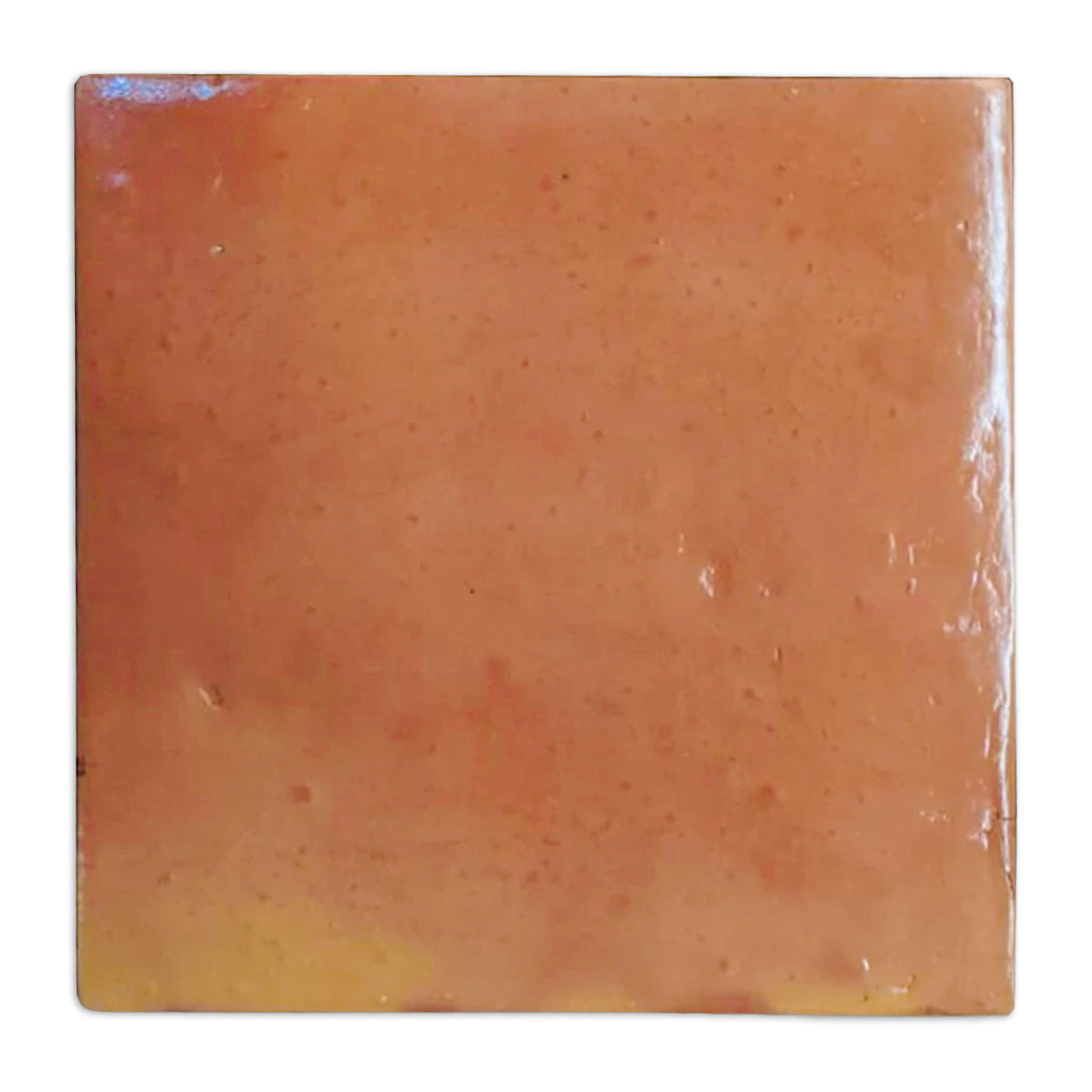 Warm orange smooth gloss tile sample by Clay Imports, with subtle surface variations and a reflective finish.