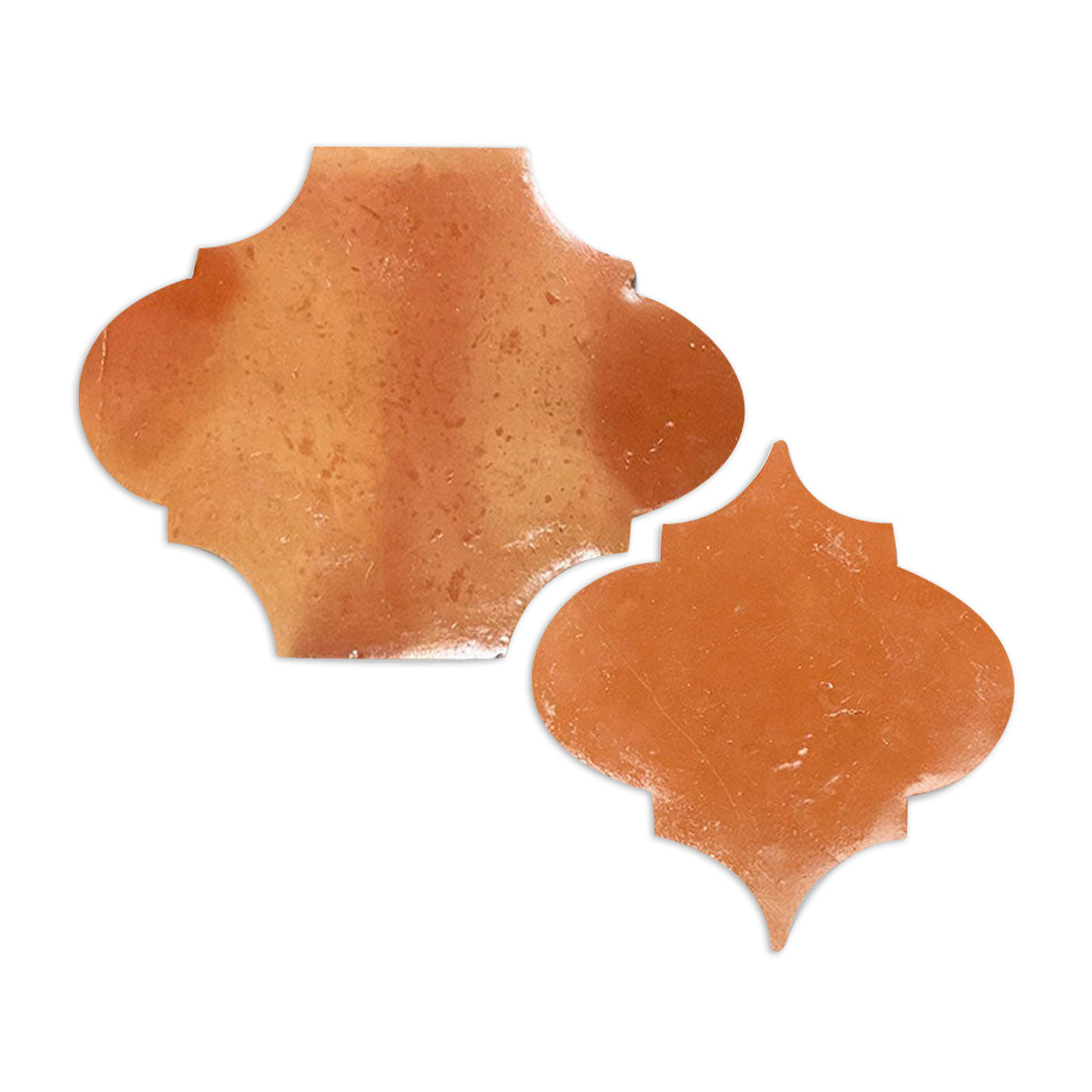 Two terracotta smooth gloss arabesque sample tiles by Clay Imports, one larger, one smaller and angled.