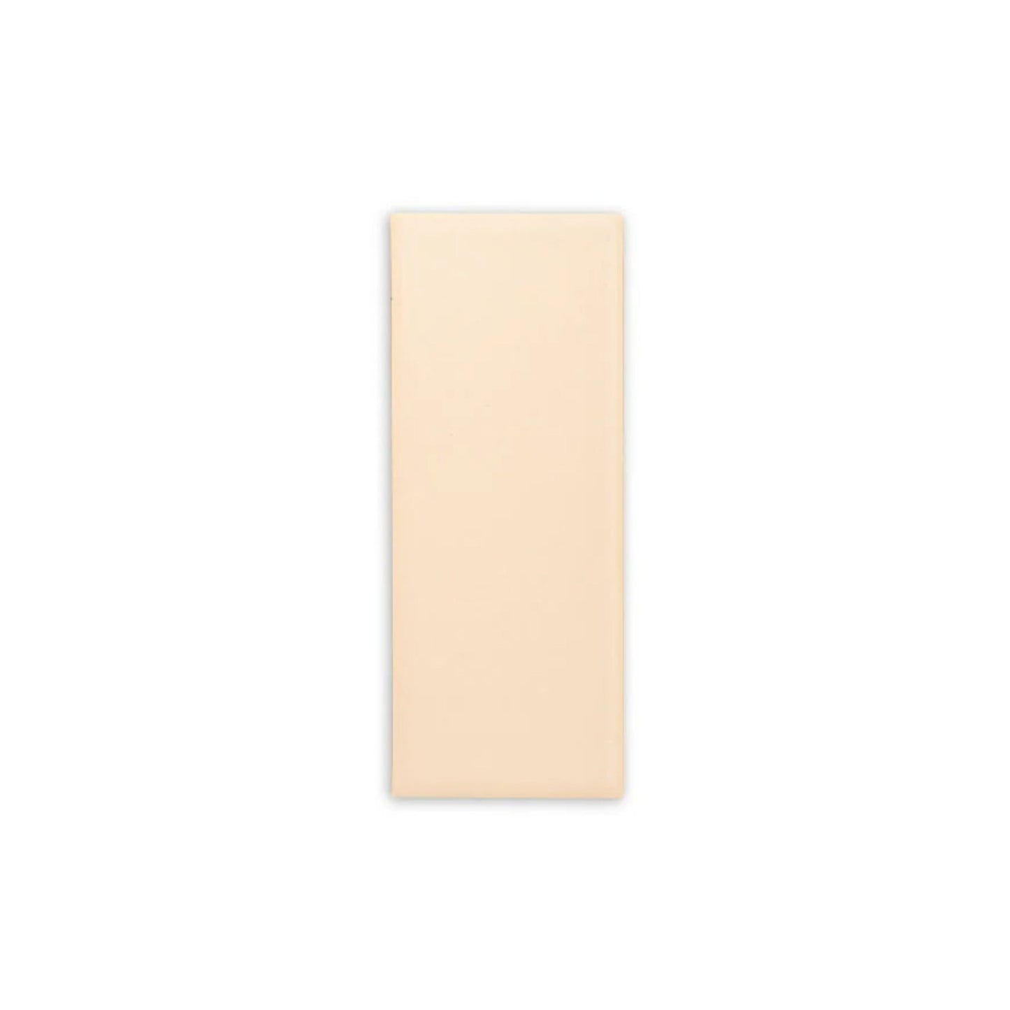 Arroyo Matte 2x5 tile sample by Clay Imports, a pale tan rectangular piece with a smooth matte finish.