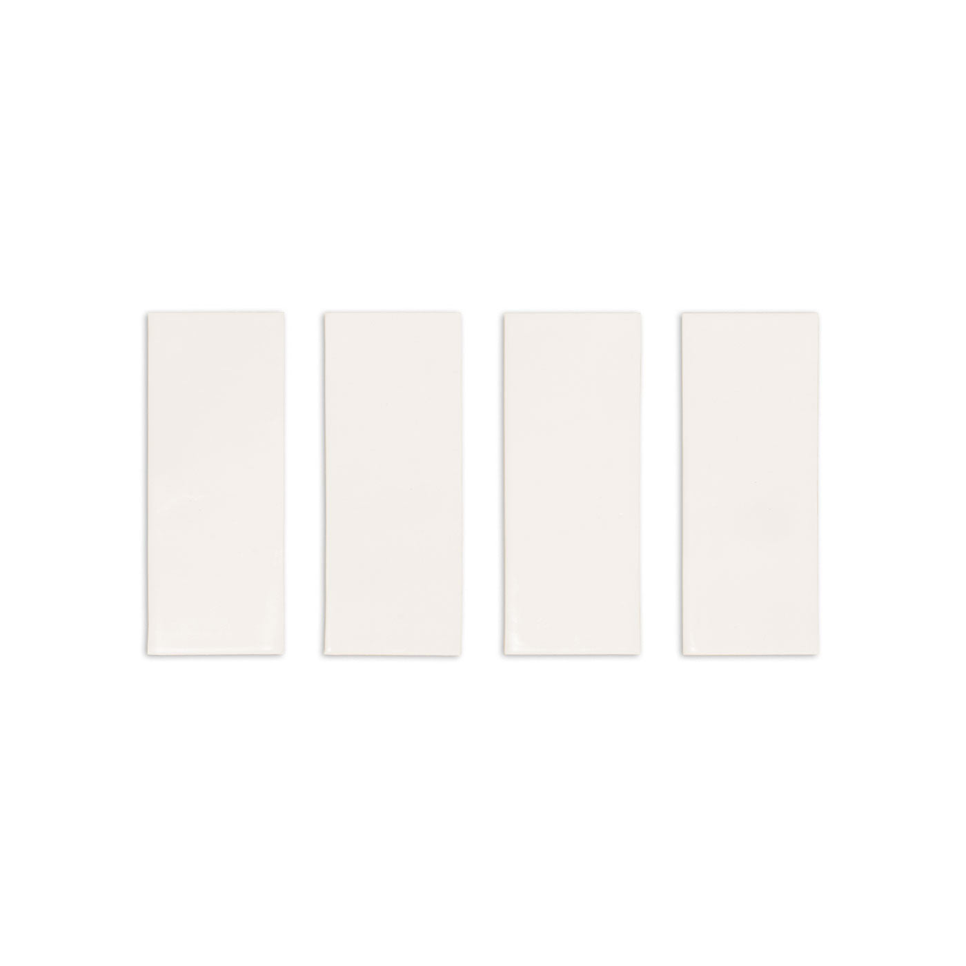 Four light off-white rectangular Fossil Gloss solid tiles by Clay Imports, arranged side-by-side.