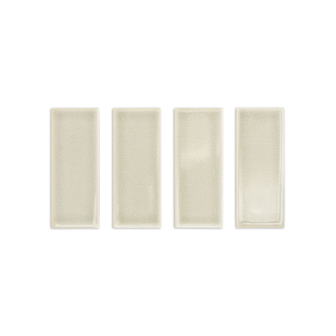 Four light beige rectangular crackle gloss tile samples by Clay Imports, showing subtle cracked textures.