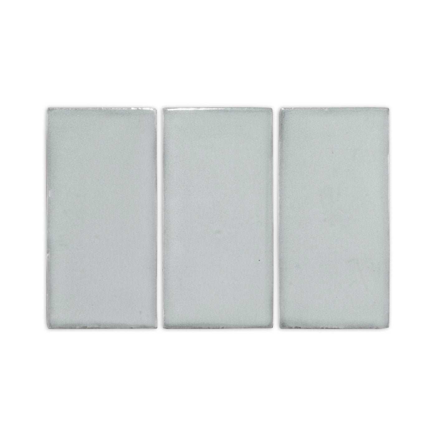 Three light grey rectangular clay tiles by Clay Imports, displayed side-by-side with a subtle handcrafted texture.