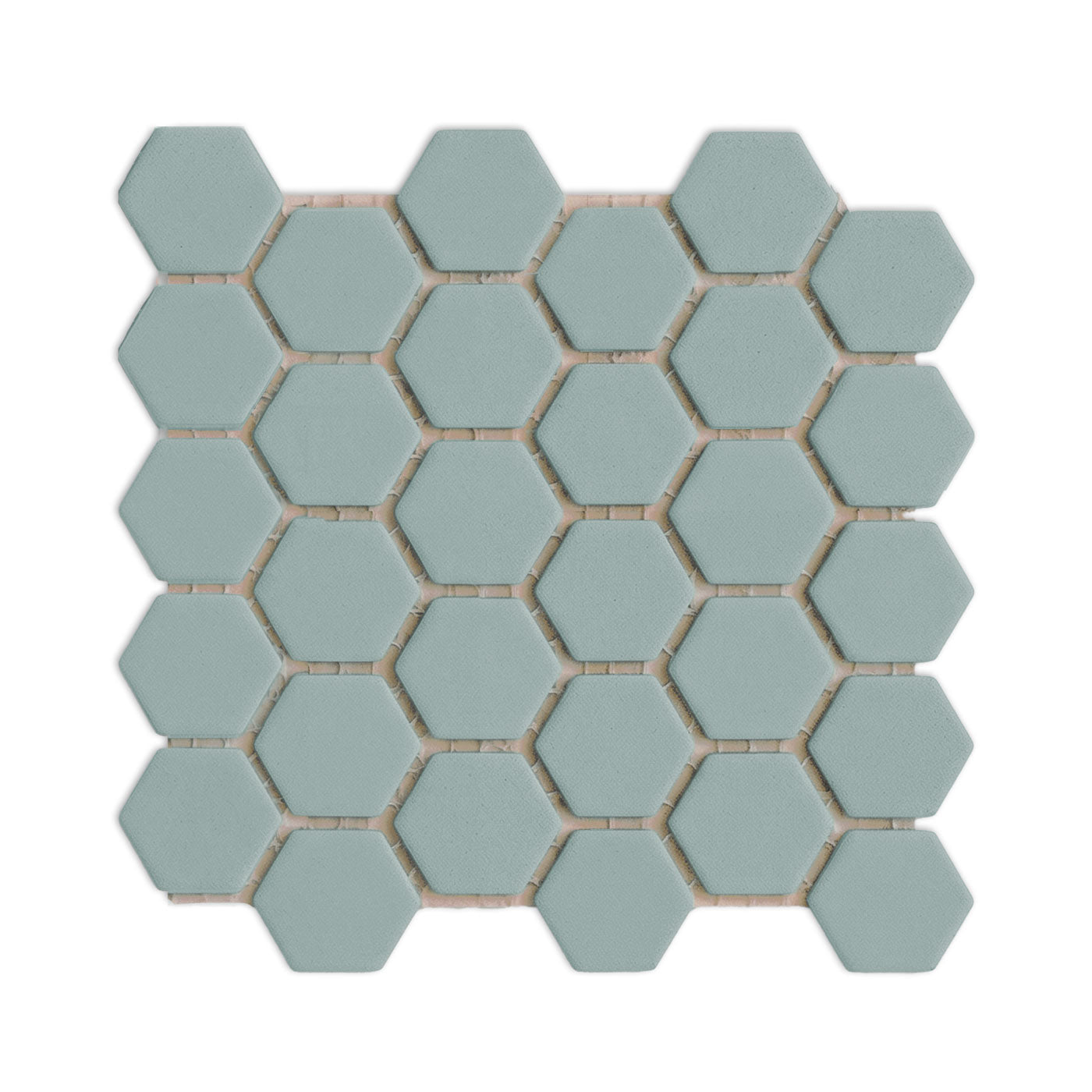 Sage green hexagon clay tiles by Clay Imports, arranged in a meshed pattern with white grout lines and subtle shadows.