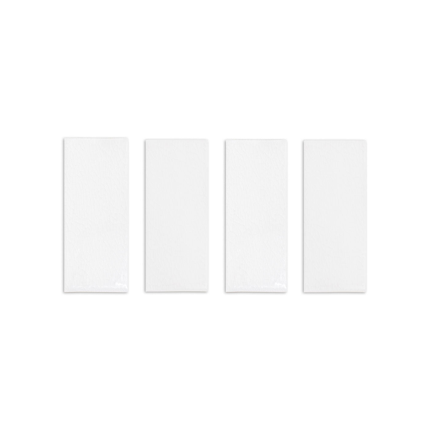 Four white rectangular solid tiles by Clay Imports with a glossy crackle texture.
