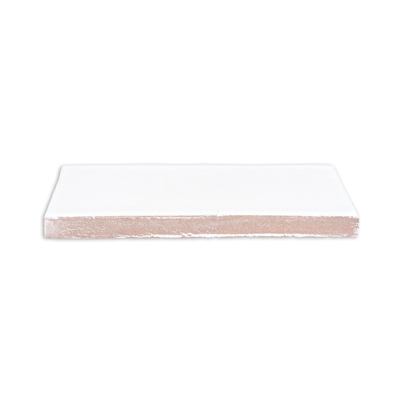 White Perla Gloss 2x6 tile by Clay Imports, showing a smooth top and rough reddish-brown underside from a side angle.
