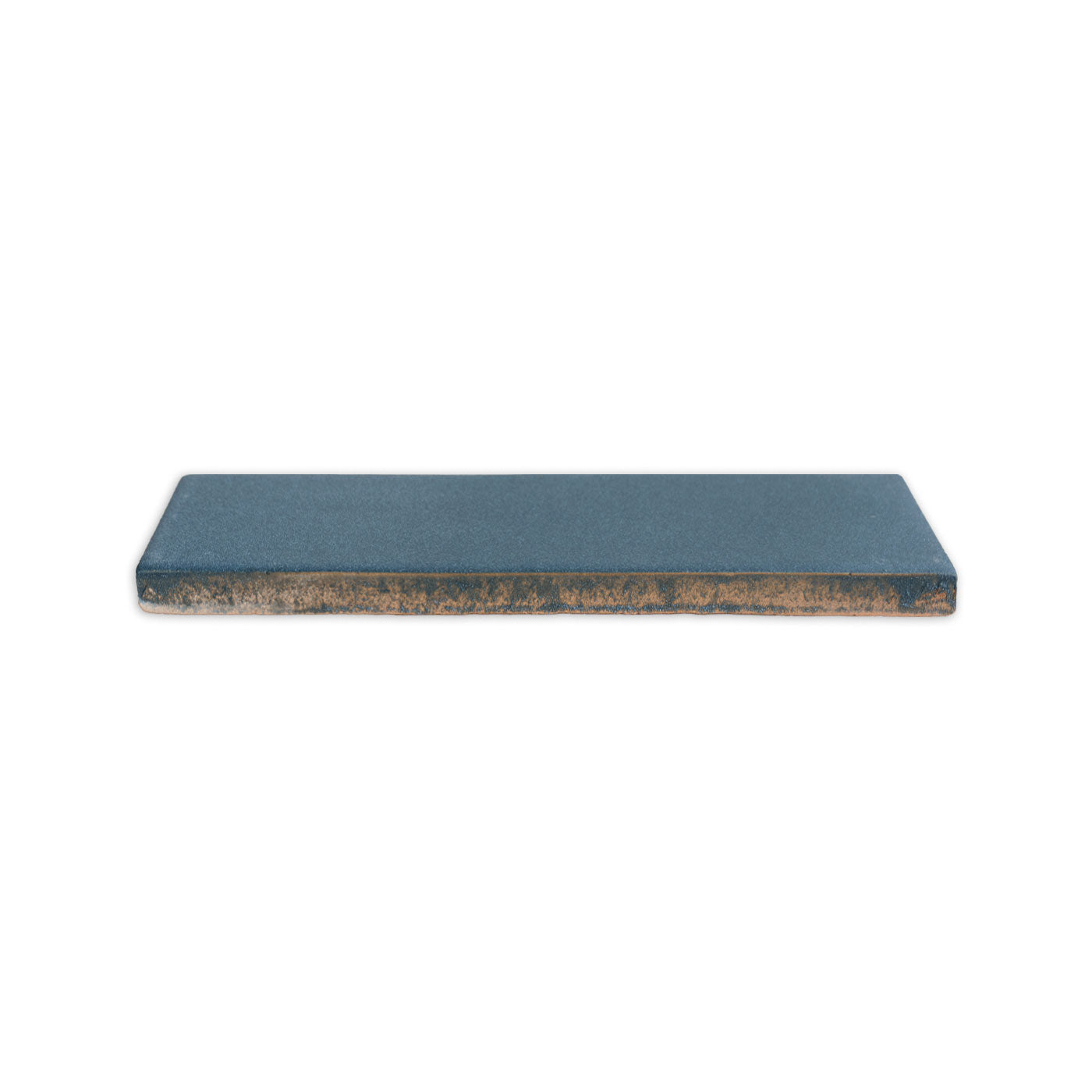 Midnight blue clay tile by Clay Imports, rectangular with a matte texture and exposed raw clay edges.