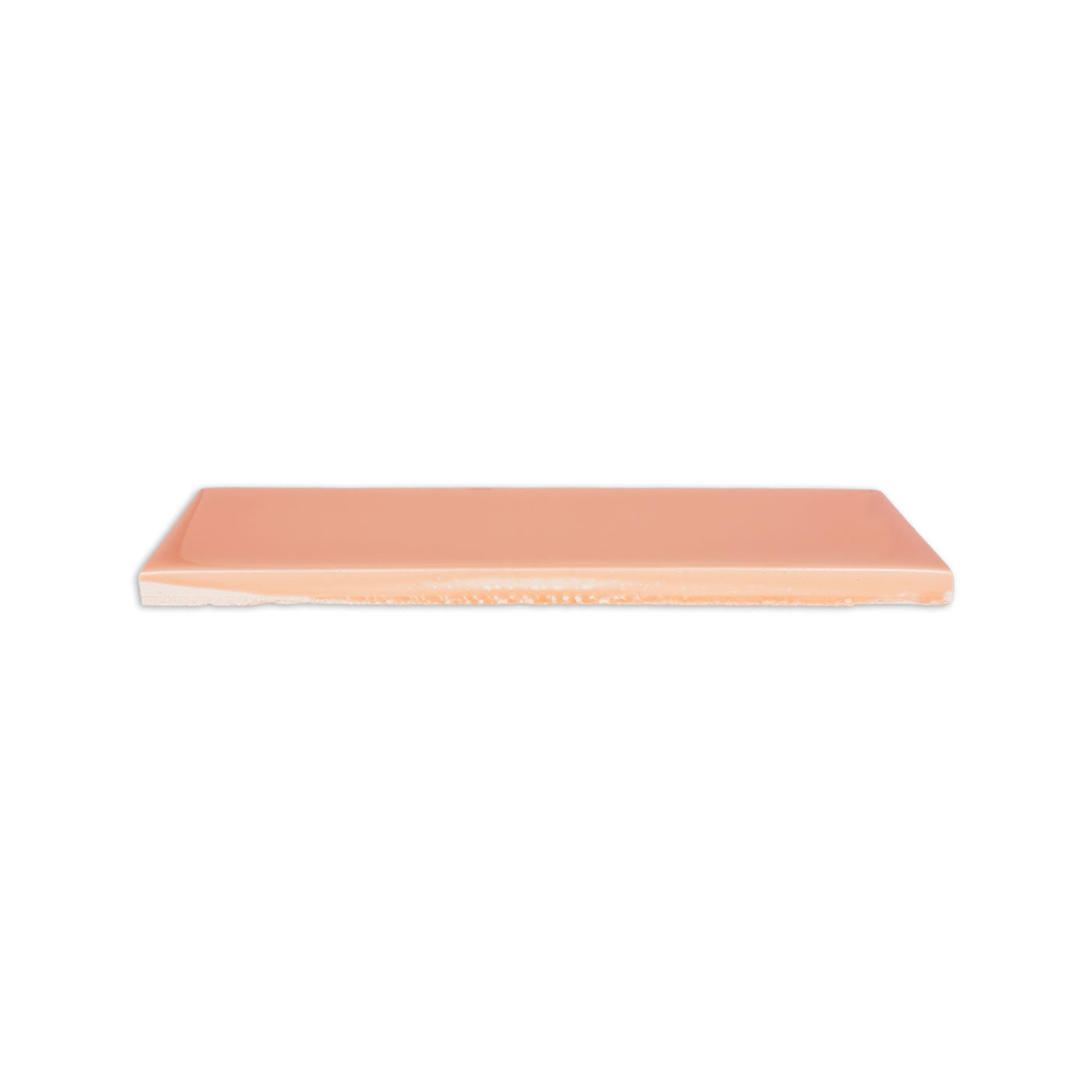 Wildflower Gloss solid tile by Clay Imports, shown in a side view revealing its glossy surface and unglazed edge.