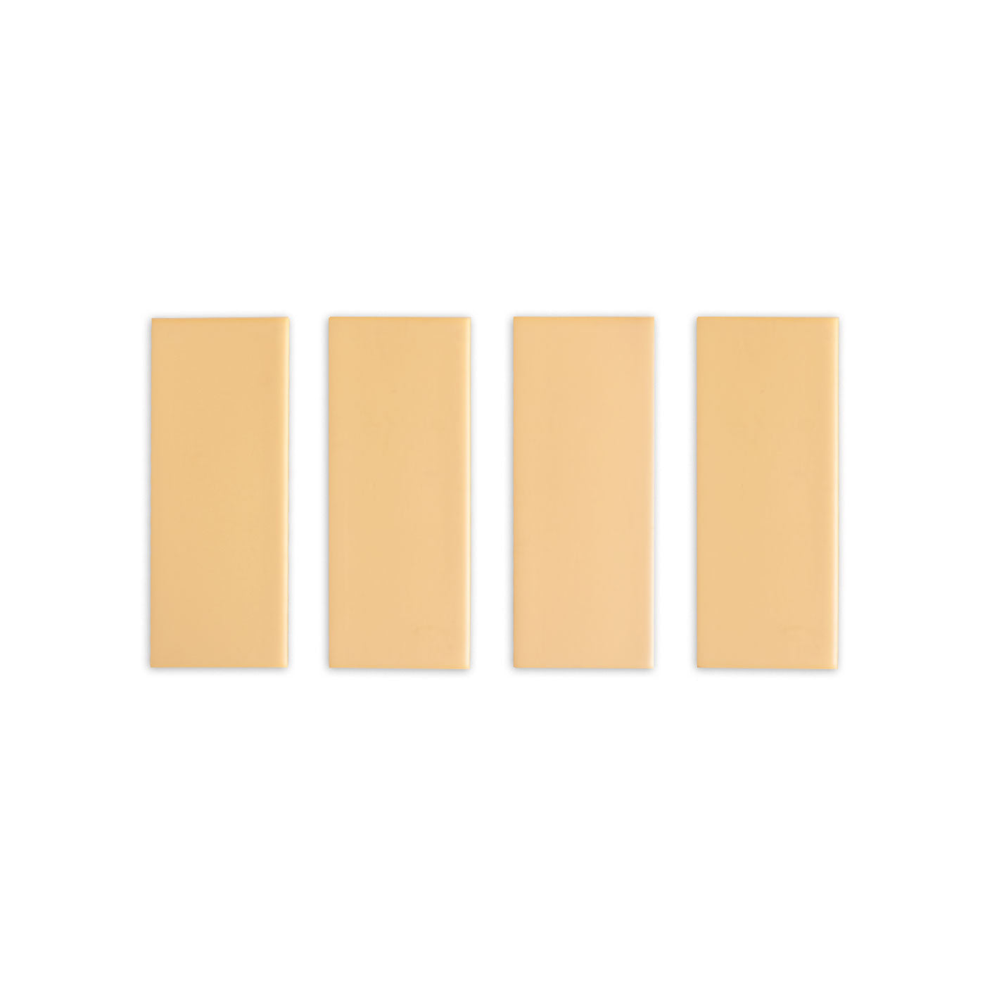 Four Sandbank Matte 2x5 sample tiles by Clay Imports, light beige with a matte finish and subtle beveled edges.