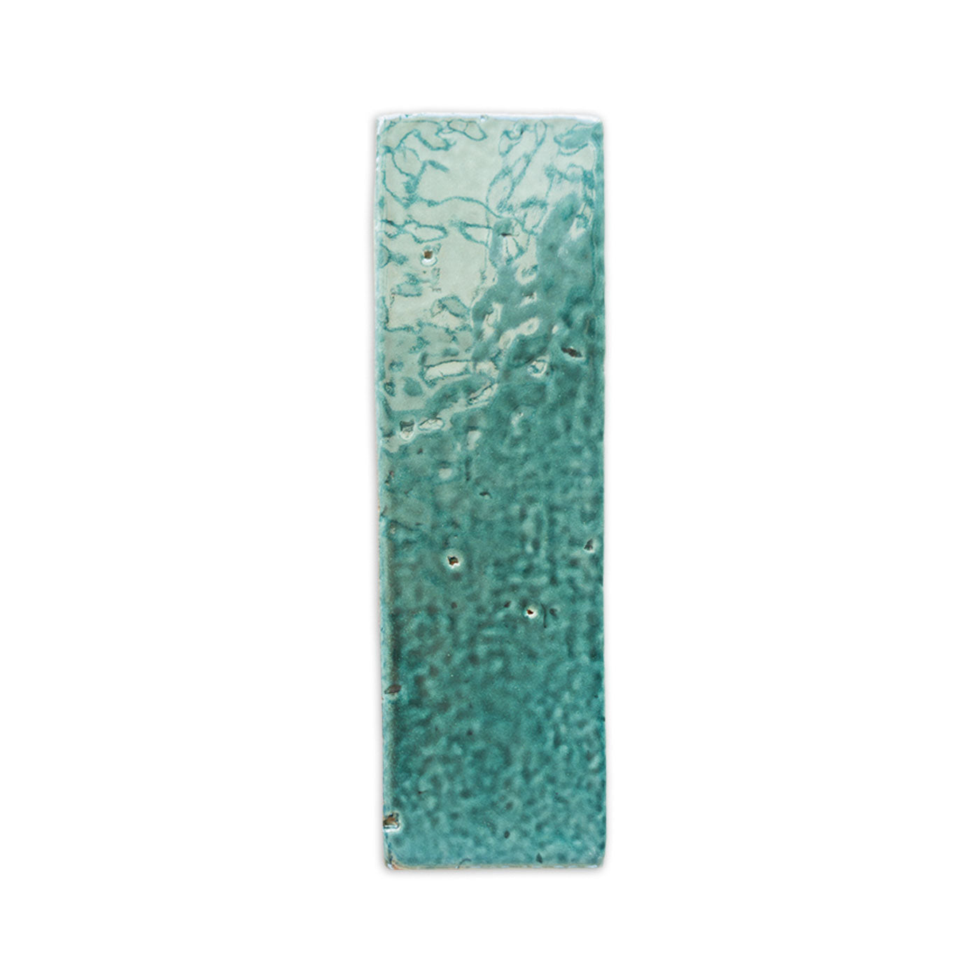 Grotto Green 2.5x8 glazed thin brick sample by Clay Imports with a glossy, variegated teal surface featuring organic patterns and a bumpy texture.