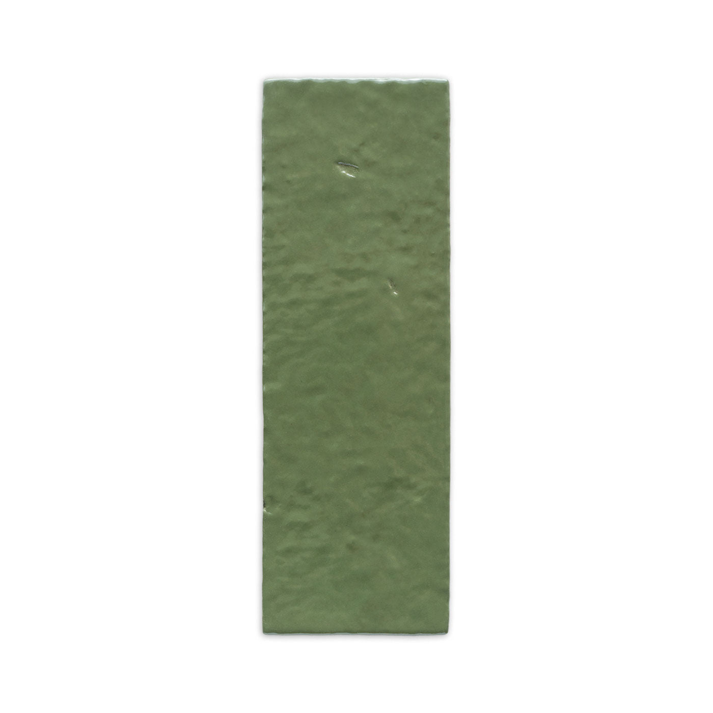 Moss green glazed thin brick from Clay Imports with a textured, rectangular surface.