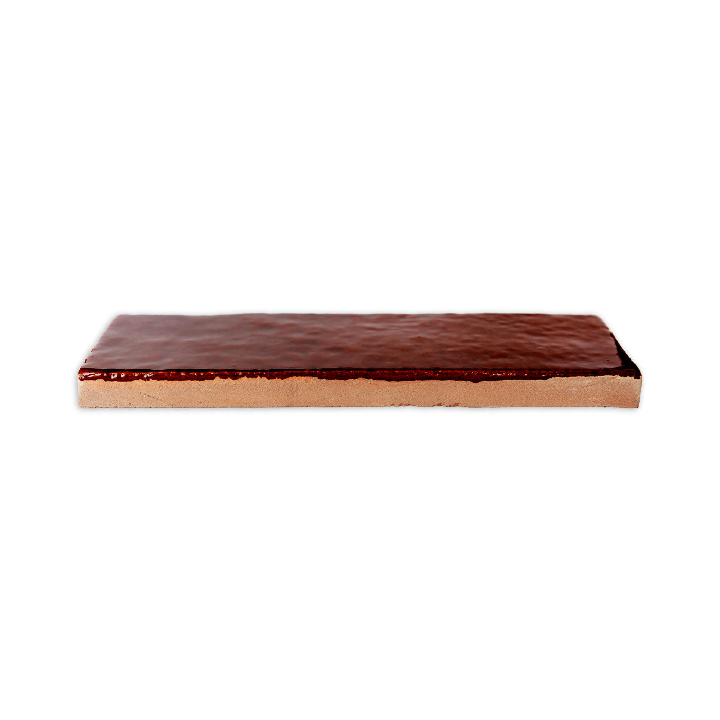 Root Beer glazed thin brick by Clay Imports with a glossy, rippled surface and an unglazed reddish-brown side.