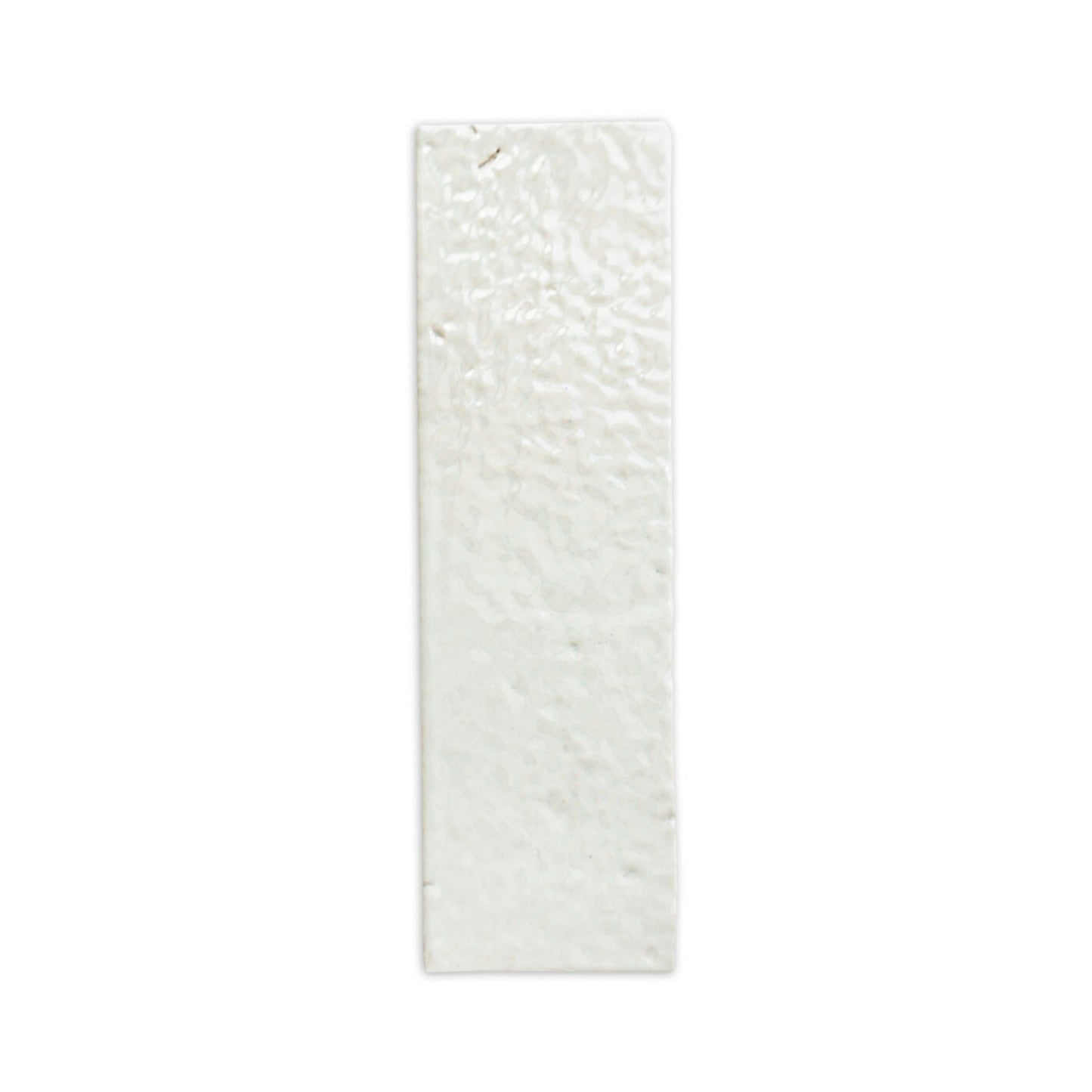 Glazed thin brick in Tonic white by Clay Imports, with a highly textured, undulating surface.