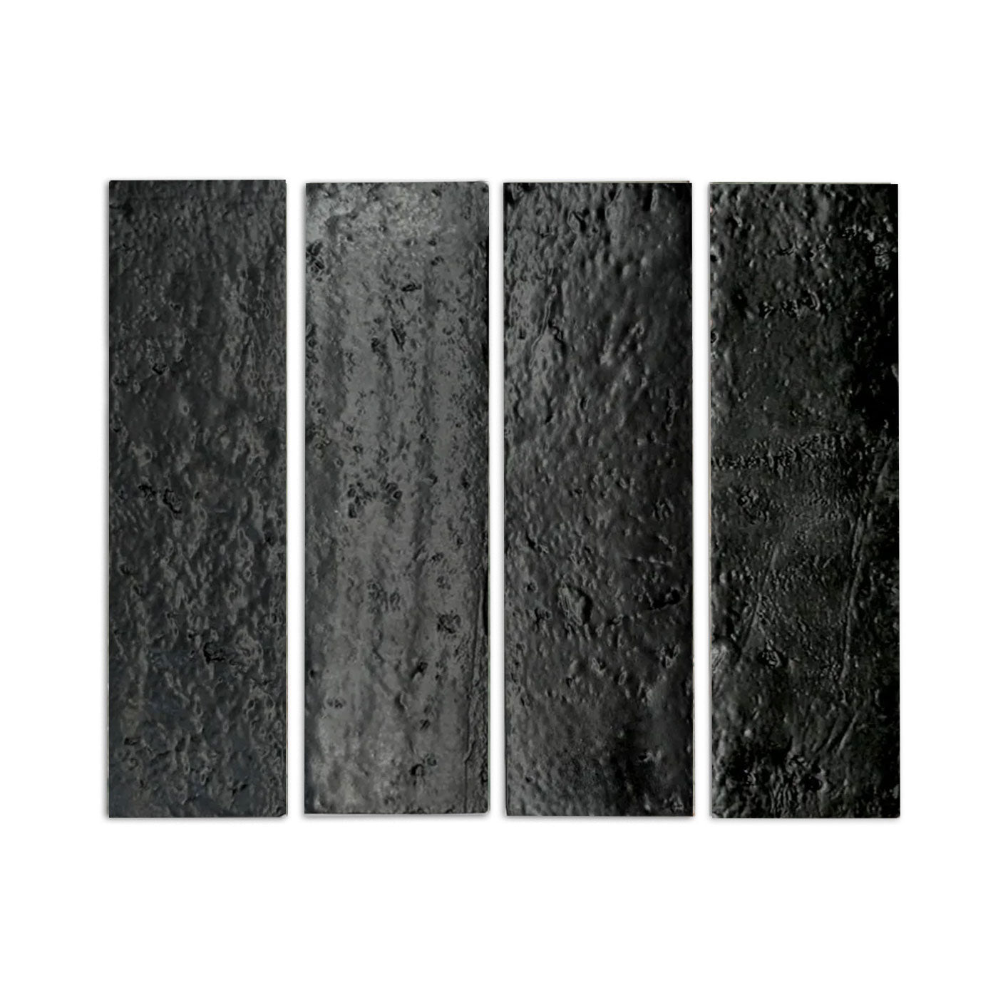 Glazed Thin Brick in Noir Black 2.5x8 by Clay Imports, showing four dark, highly textured, rough tiles.