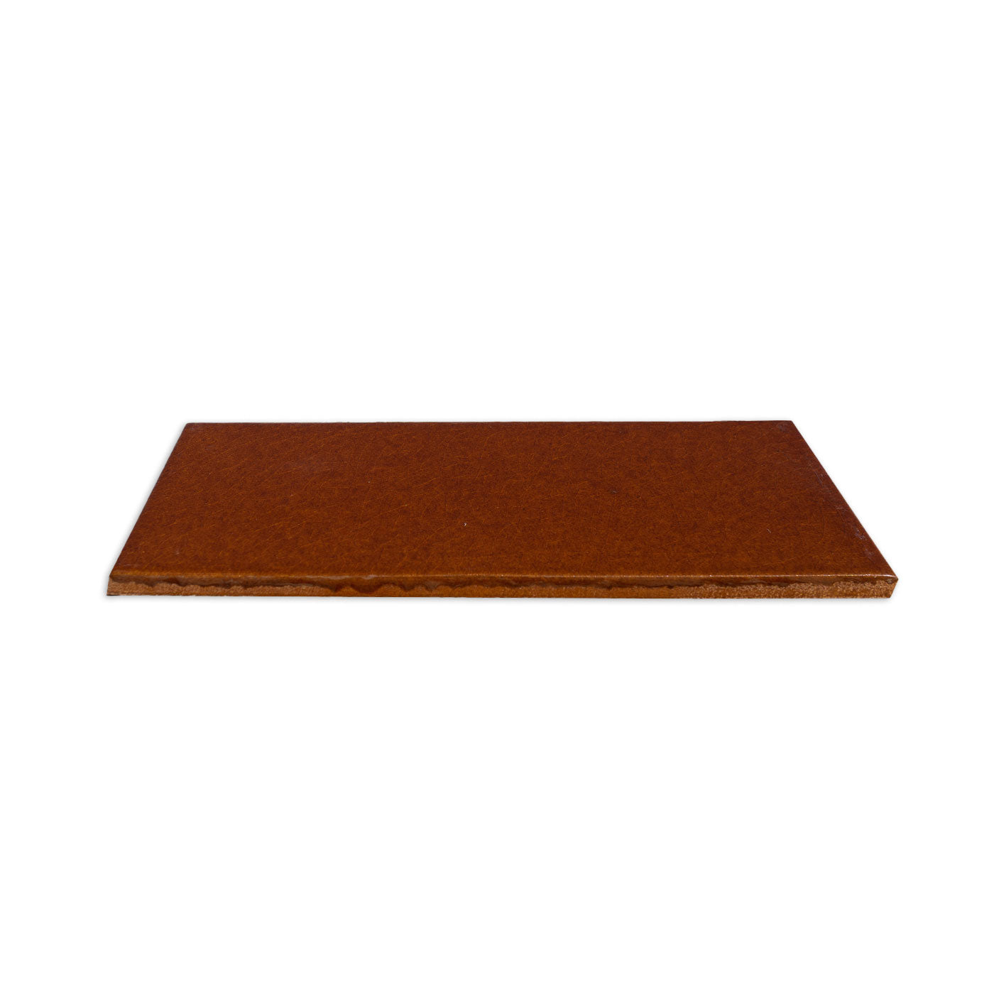 Reddish-brown solid tile by Clay Imports with a matte, textured surface, viewed from the side.
