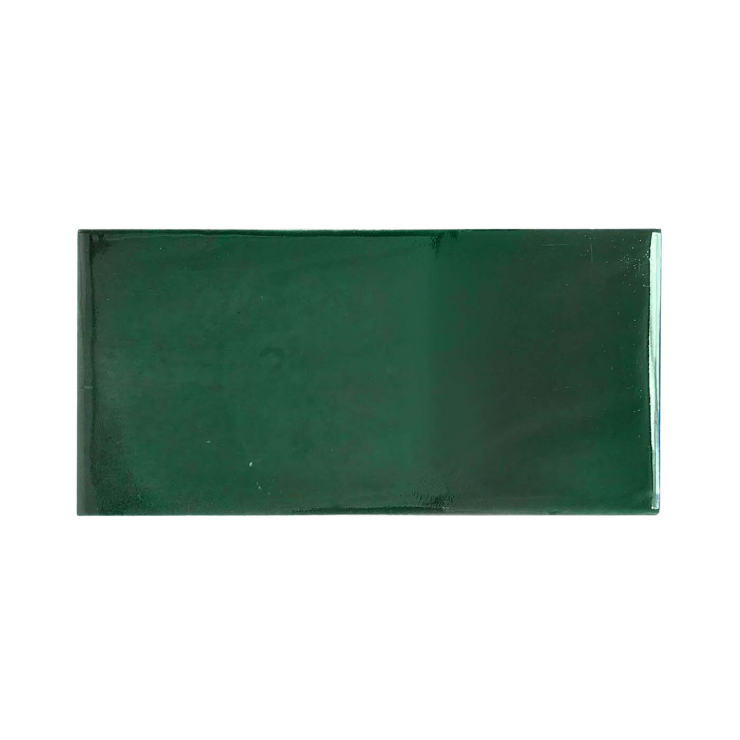 Dark green subway tile sample by Clay Imports, with a glossy finish.