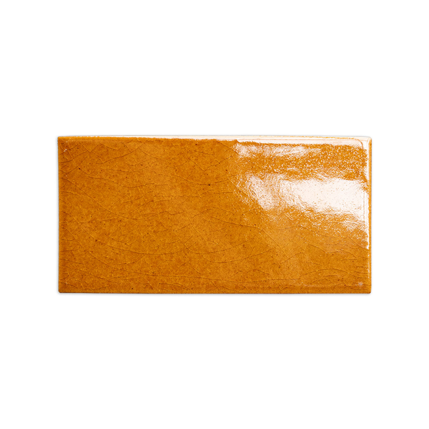Earthy orange crackle tile sample by Clay Imports, featuring a glossy finish and fine crackled texture.