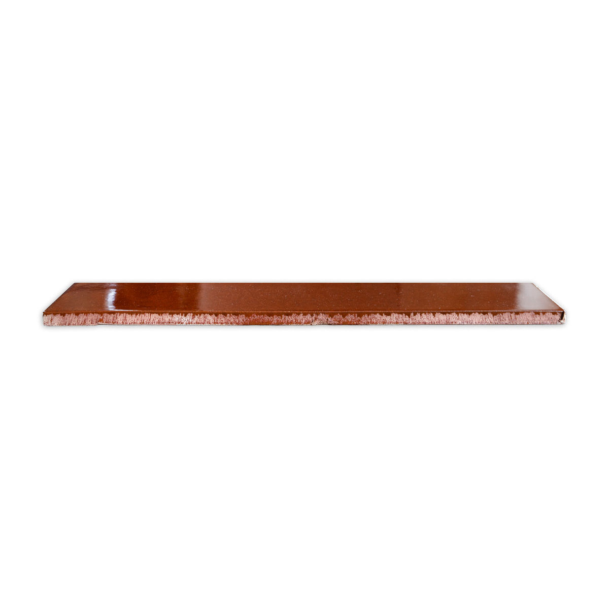 Americano solid tile in warm brown by Clay Imports, with a sparkling surface and rough-cut side edge.