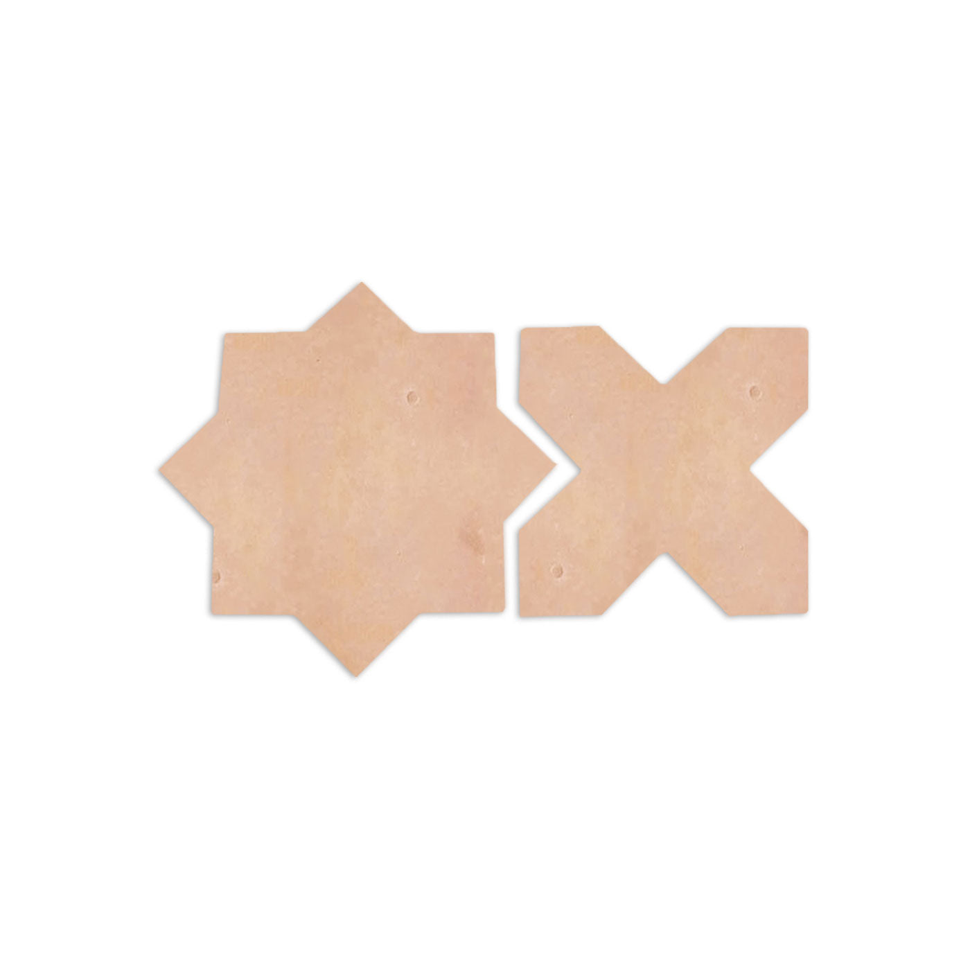Smooth matte star and cross sample tiles by Clay Imports in a light terracotta hue.