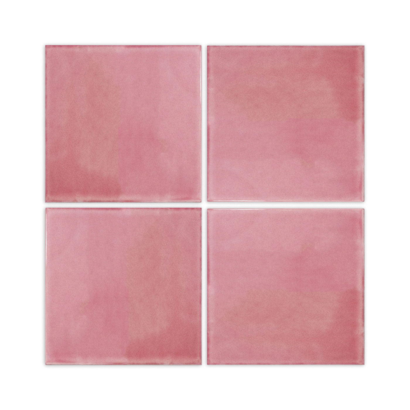 Four dusky pink solid tiles by Clay Imports, showing a varied glossy finish arranged in a 2x2 grid.