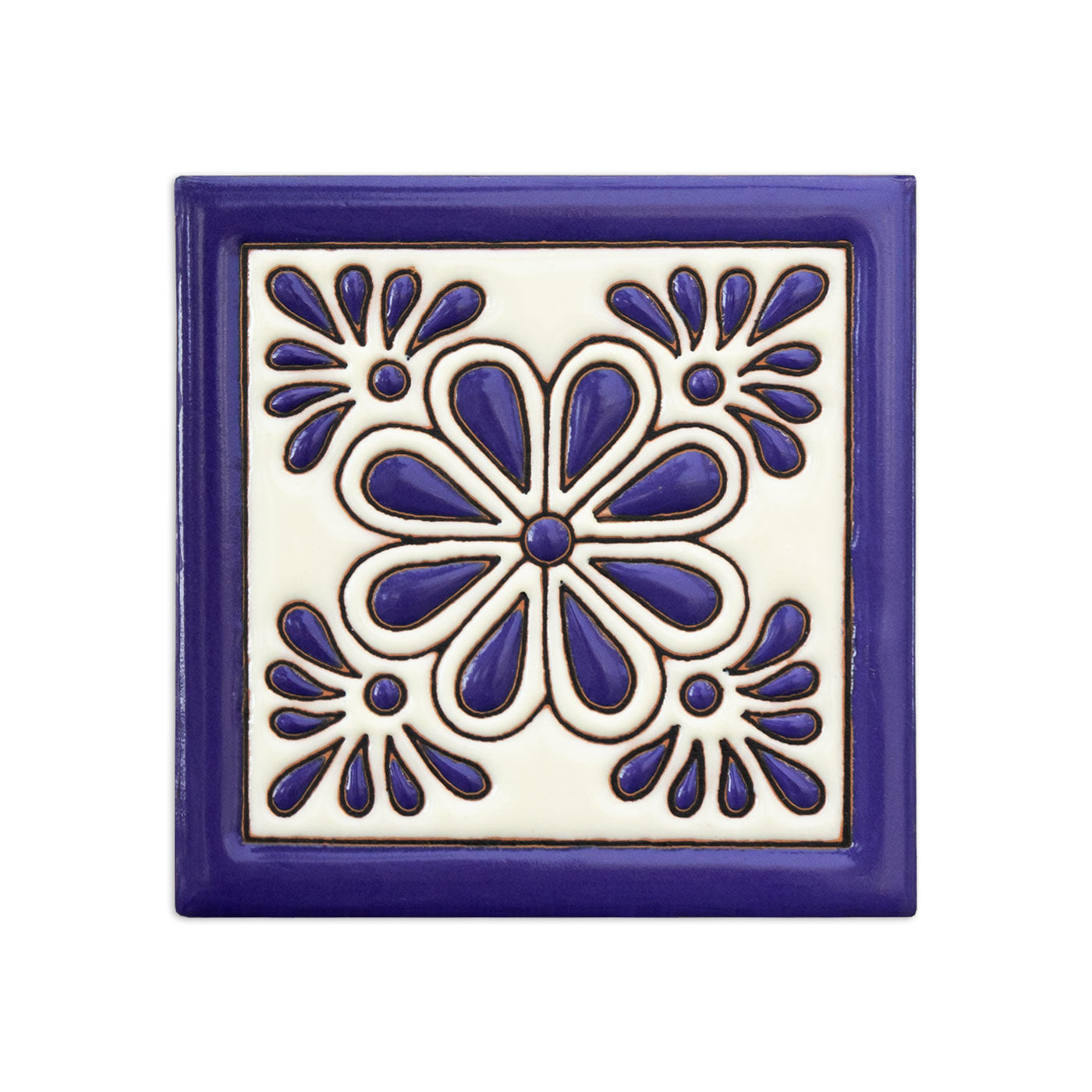Blue and white glossy relief ceramic tile by Clay Imports, featuring a Gerbera flower pattern with corner accents.
