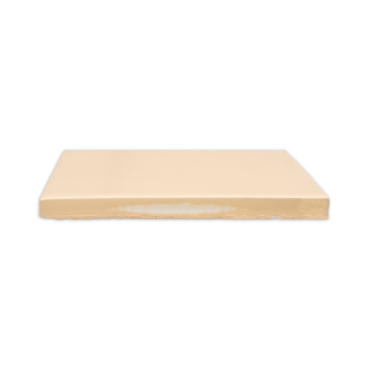 Light beige matte solid tile by Clay Imports, shown from the side revealing its rough unglazed edge.