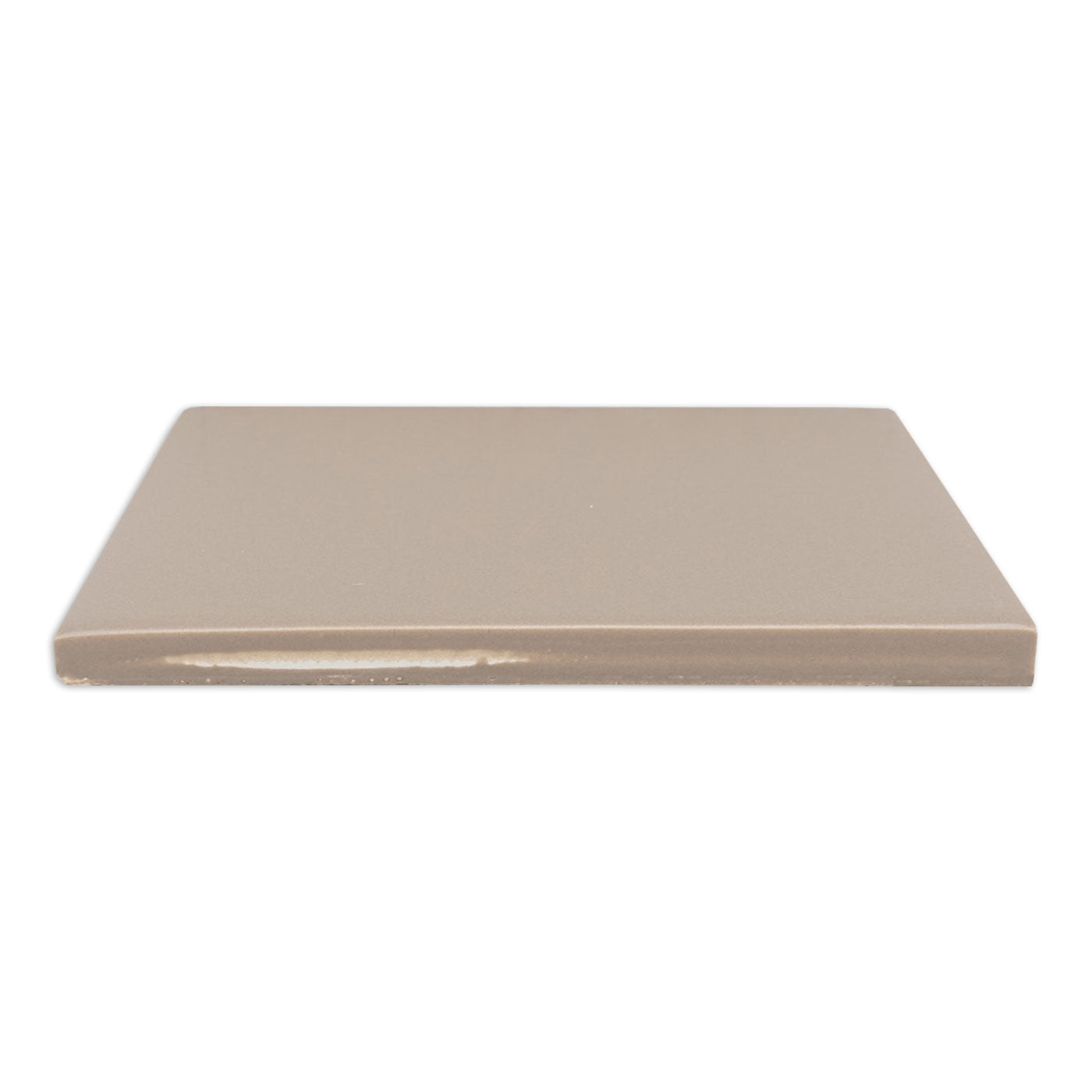 Palo Santo matte solid tile by Clay Imports, displayed from the side showing its uniform surface and unglazed edge.