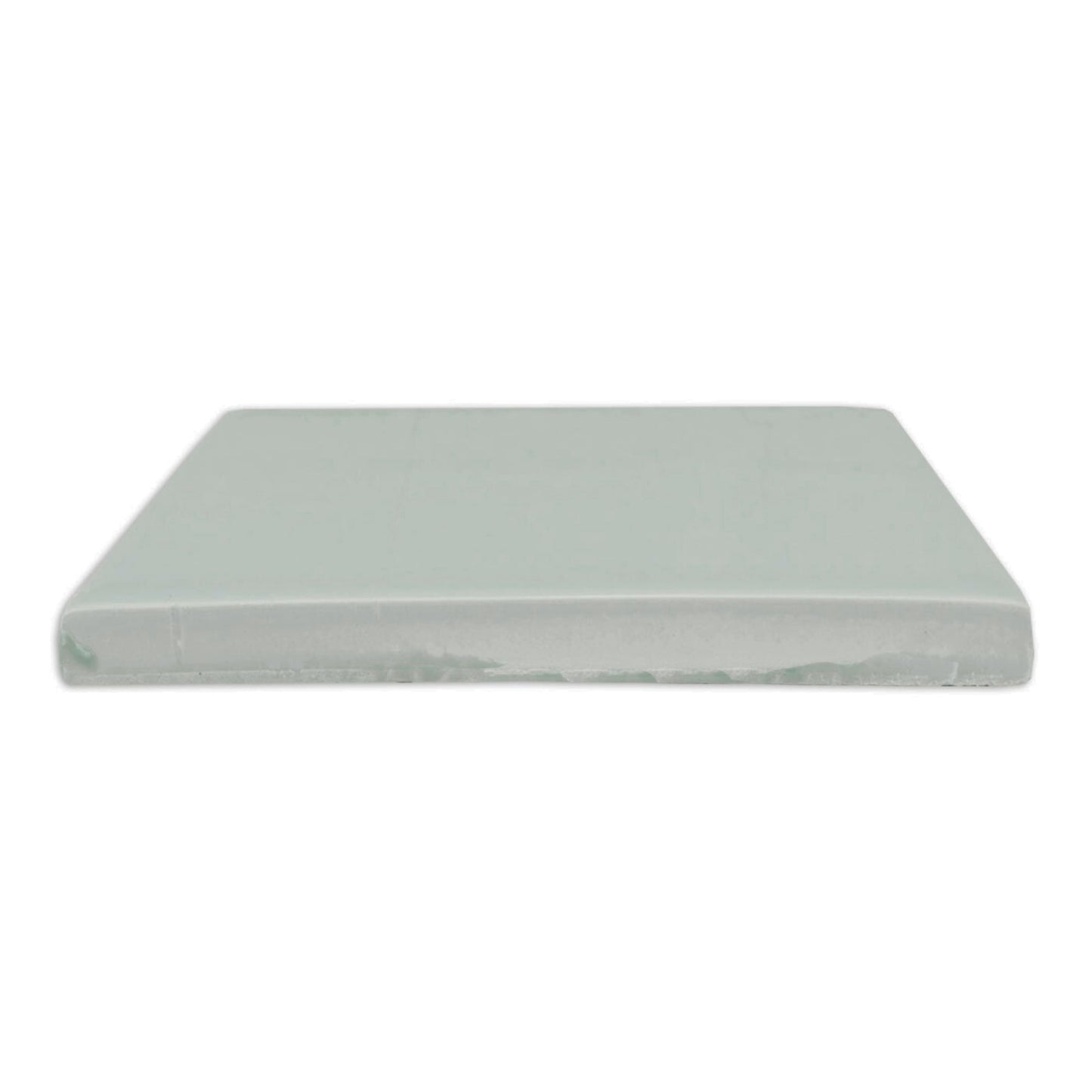 Light mint green glossy solid tile by Clay Imports, viewed from the side.