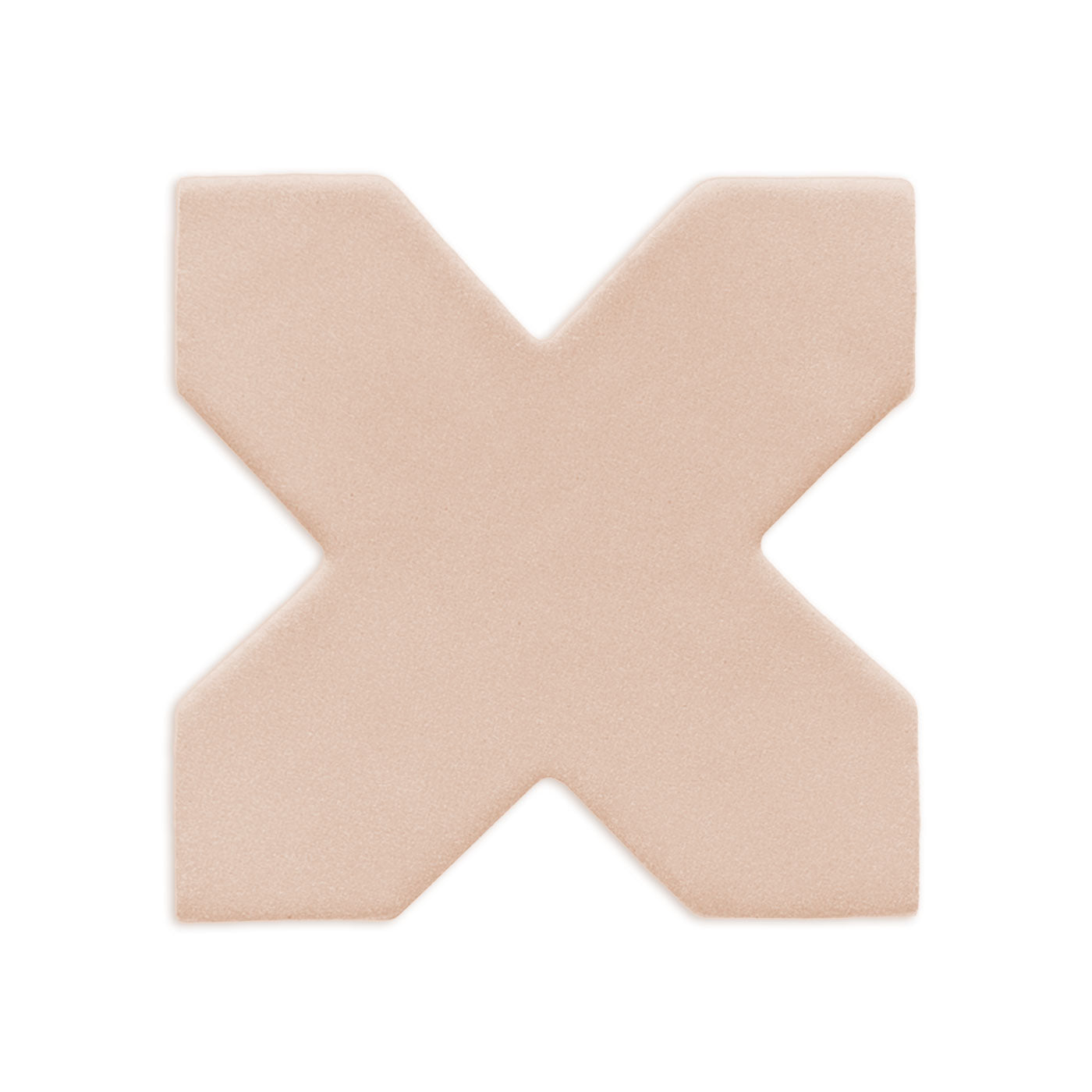 Light beige cross-shaped clay rattler by Clay Imports, with a matte, textured finish and rounded edges.