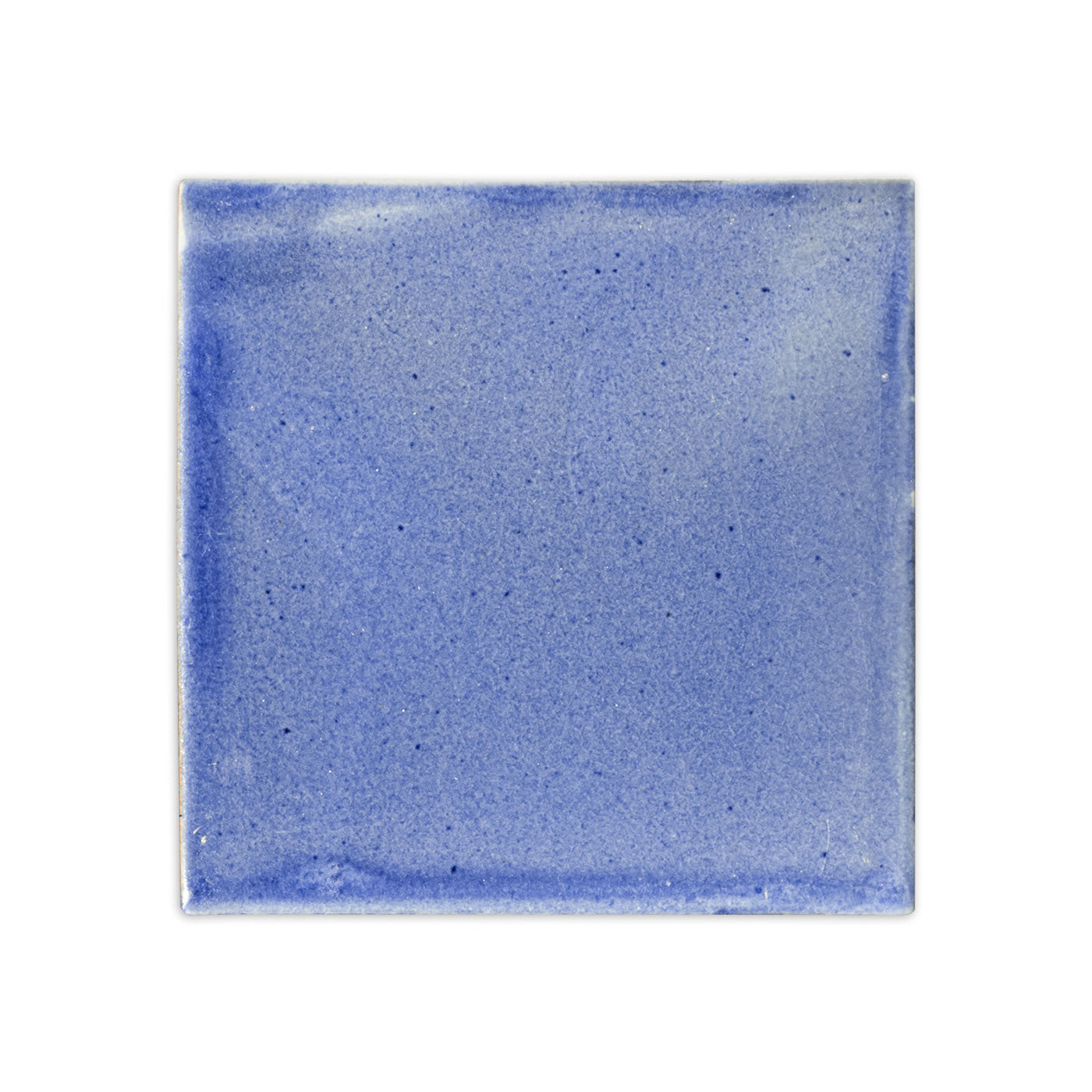 A blue square clay tile by Clay Imports with a speckled texture and uneven edges.