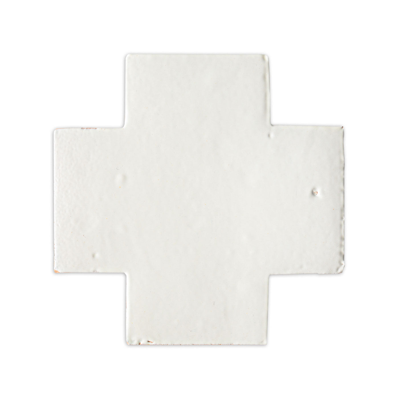 Glazed Swiss Cross tile in Tupelo Blanco by Clay Imports, featuring a textured surface and worn edges.