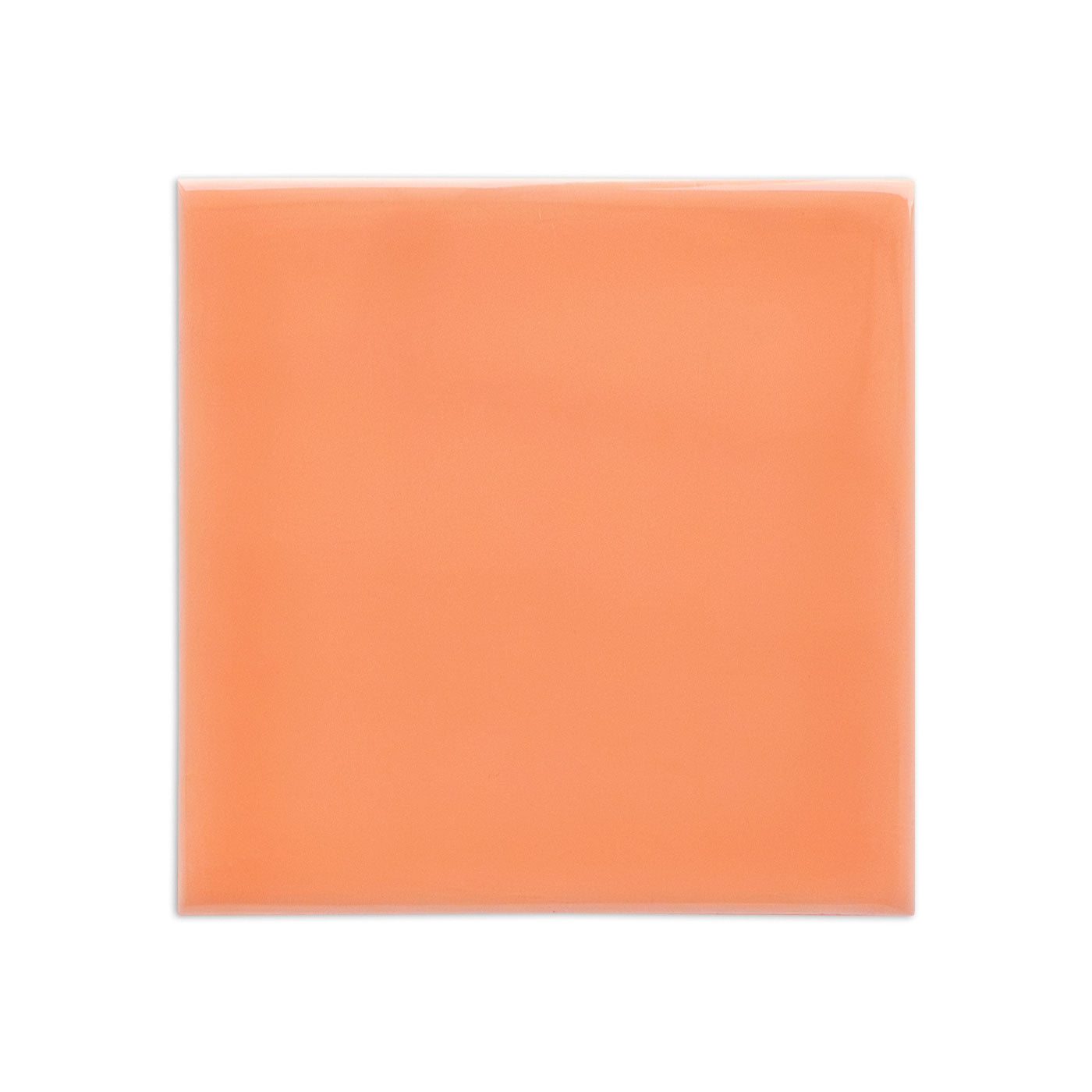 A peach 4x4 Wildflower Gloss solid tile by Clay Imports, featuring a smooth, reflective surface and rounded, glossy edges.