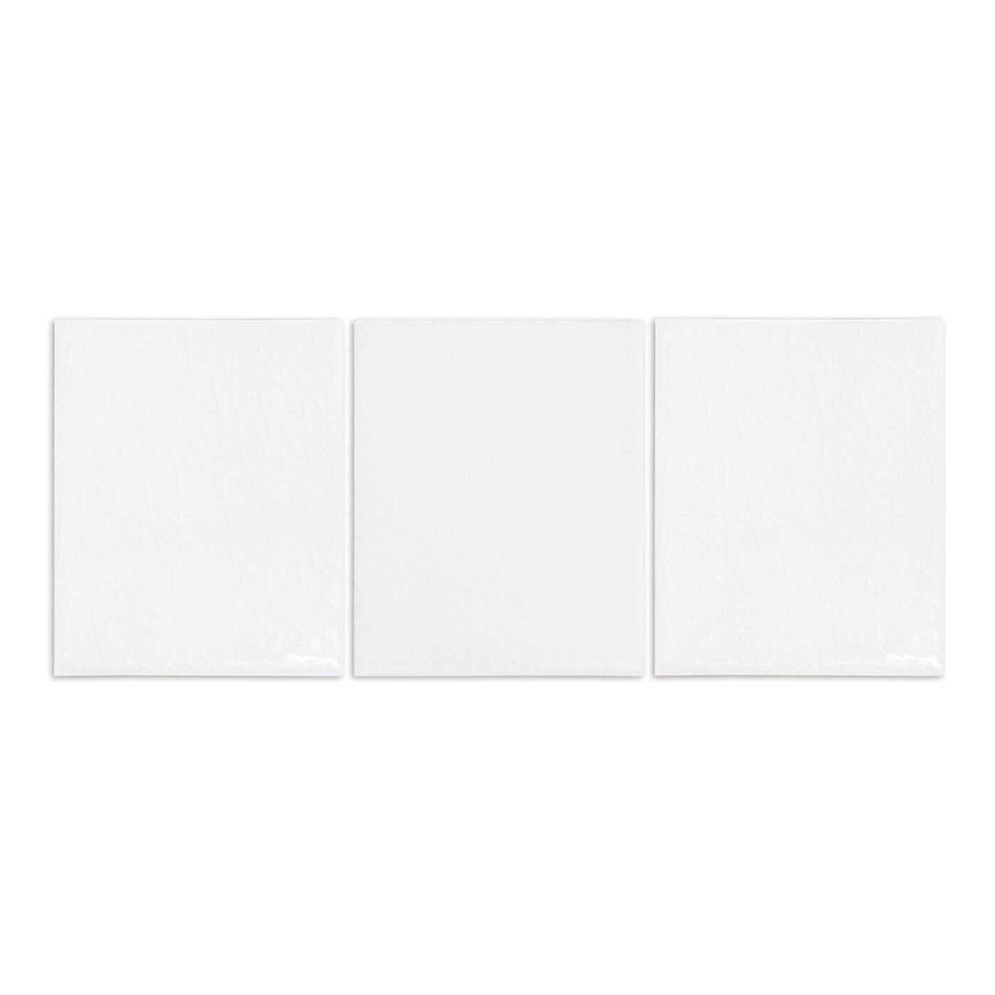 Three white crackle gloss solid tiles by Clay Imports, arranged in a row.