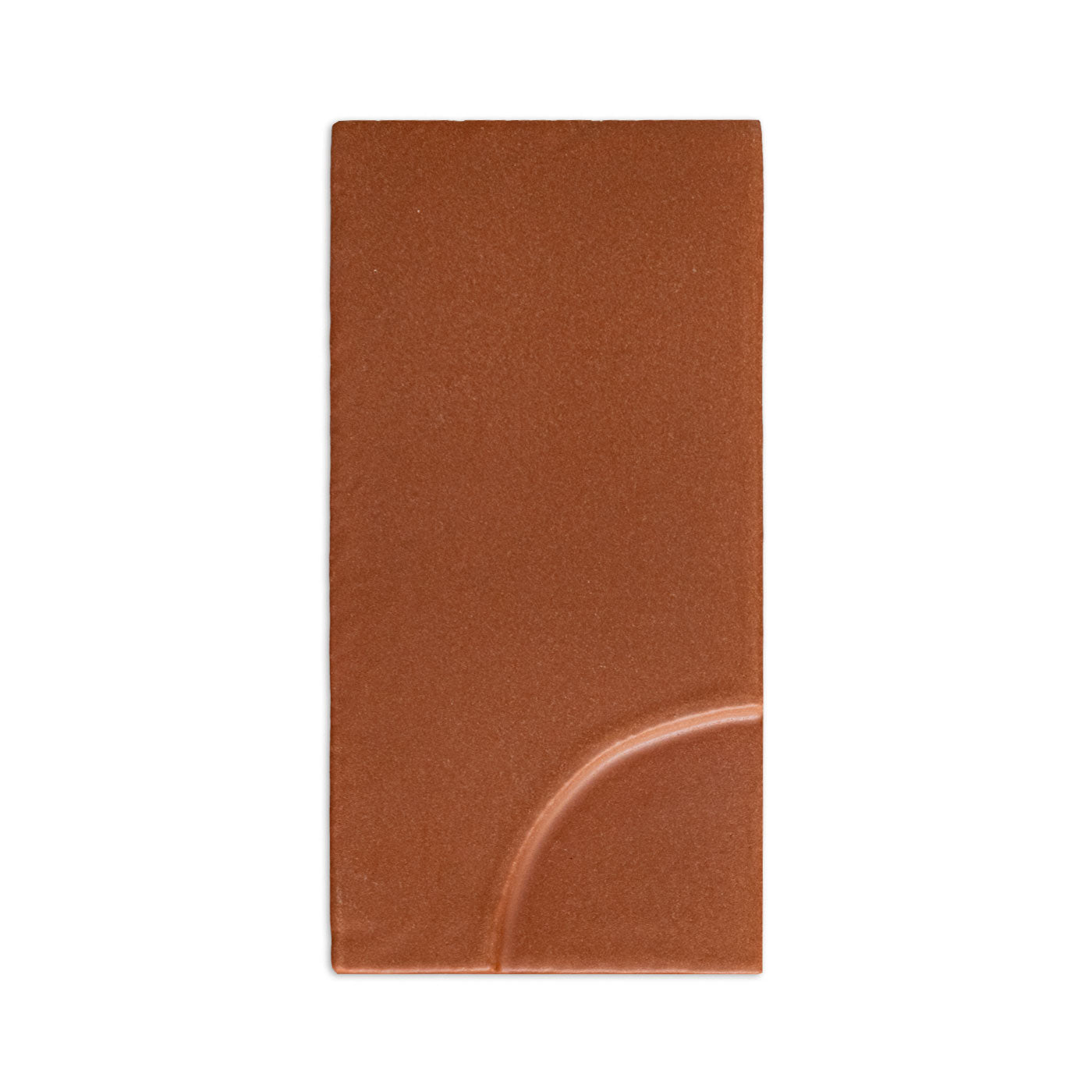 Mamey reddish-brown tile sample by Clay Imports with a raised quarter-circle in the bottom right.