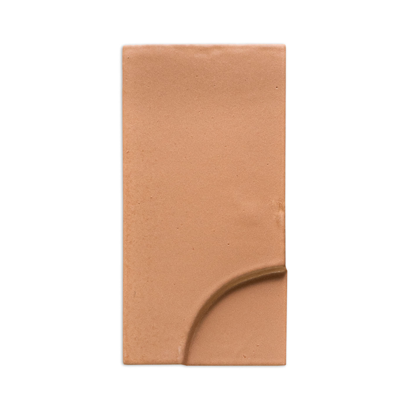 Terracotta rectangular tile sample by Clay Imports with a dark, smooth curved channel on the bottom right.