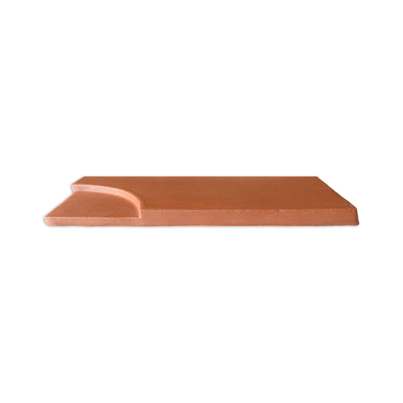 Shaped mamey clay tile by Clay Imports with a distinct curved edge, viewed from the side.