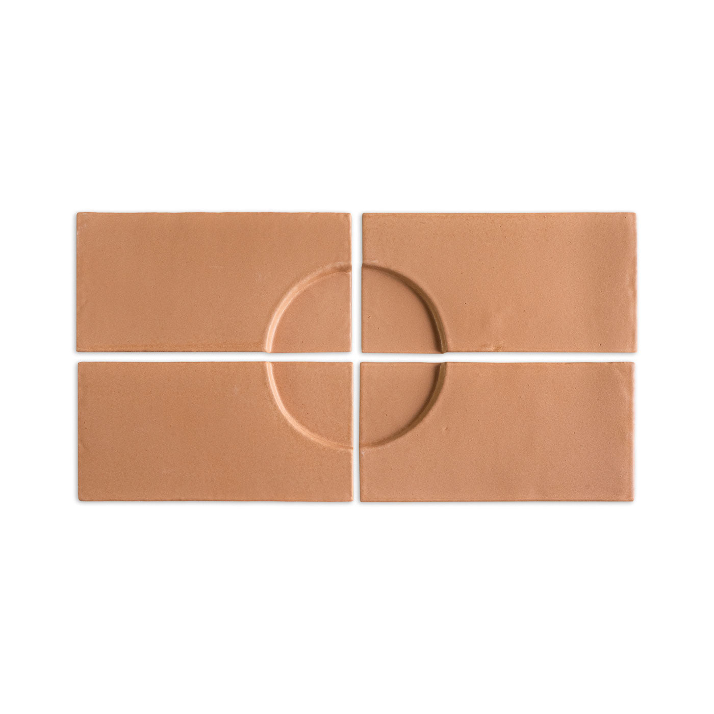 Earthy terracotta rectangular tiles by Clay Imports arranged to form an embossed circular design.
