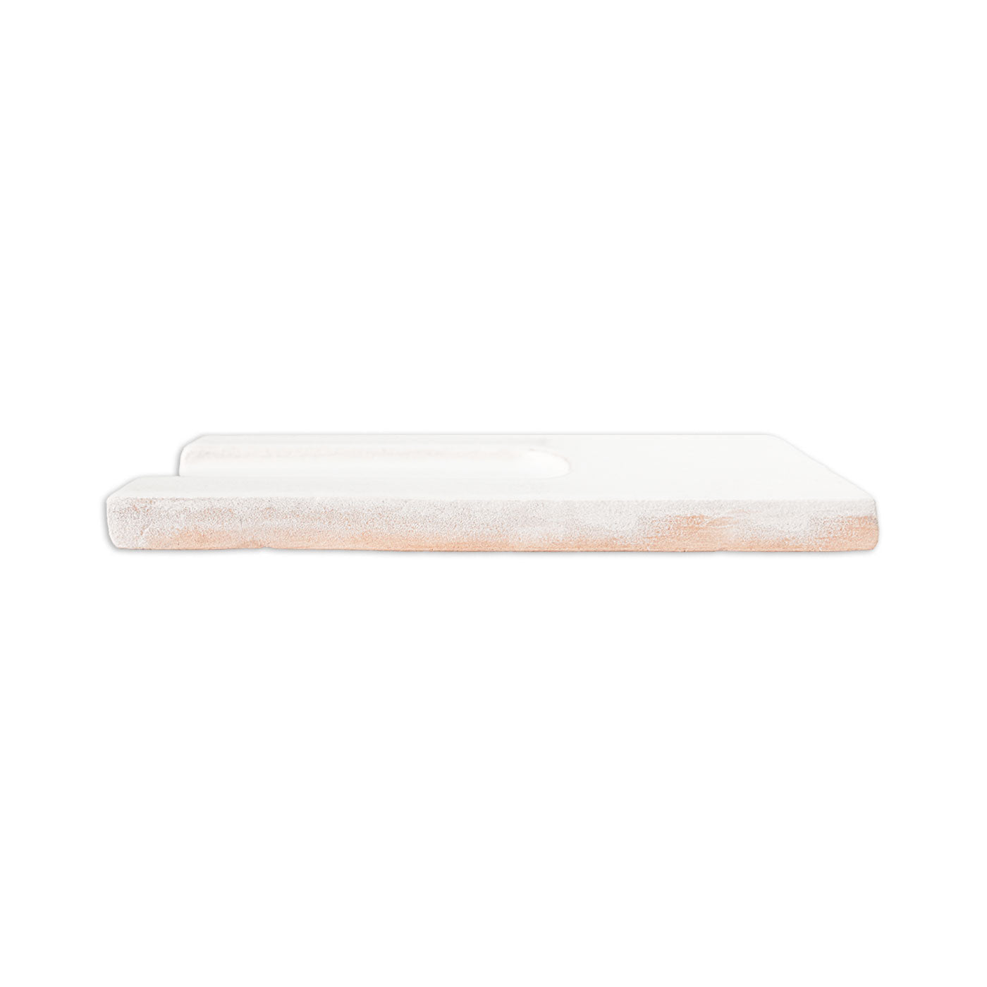 A rectangular light brown and white Hueco clay shape block by Clay Imports, with a rough, chalky texture on top, seen from the side.