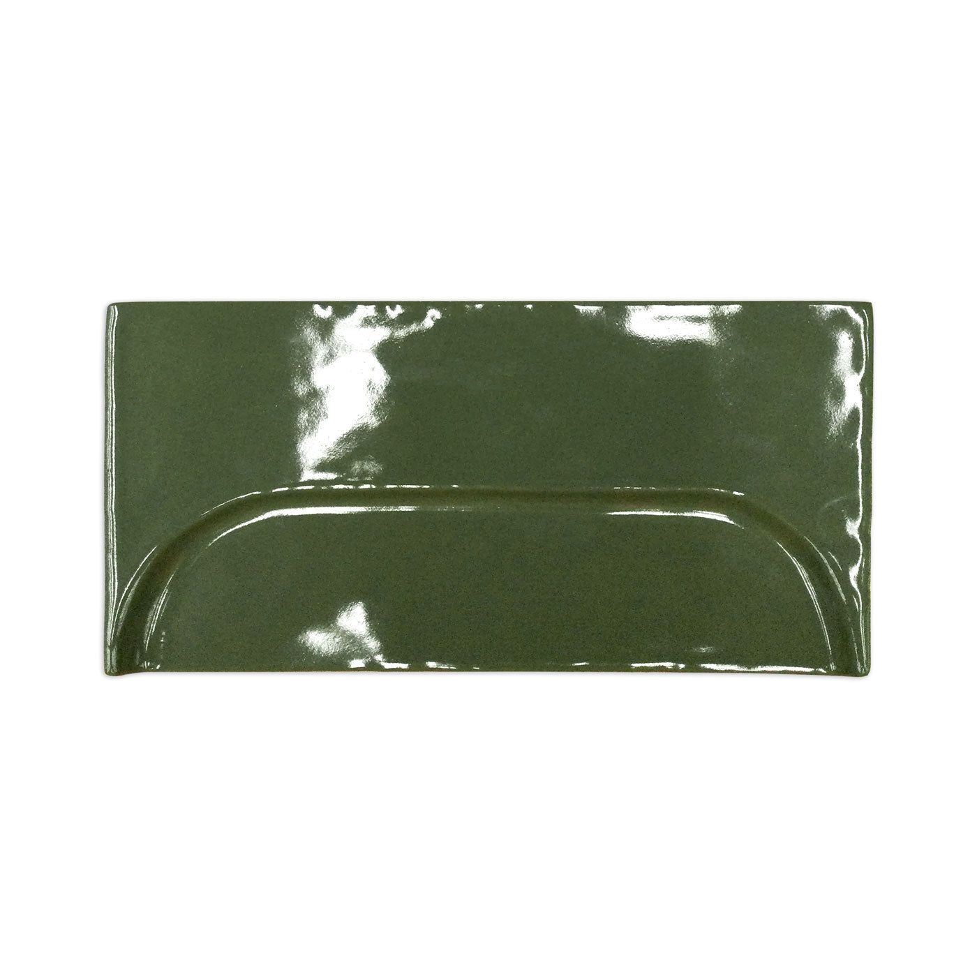Glossy moss green 4x8 rectangular tile by Clay Imports, featuring a central raised oval design.