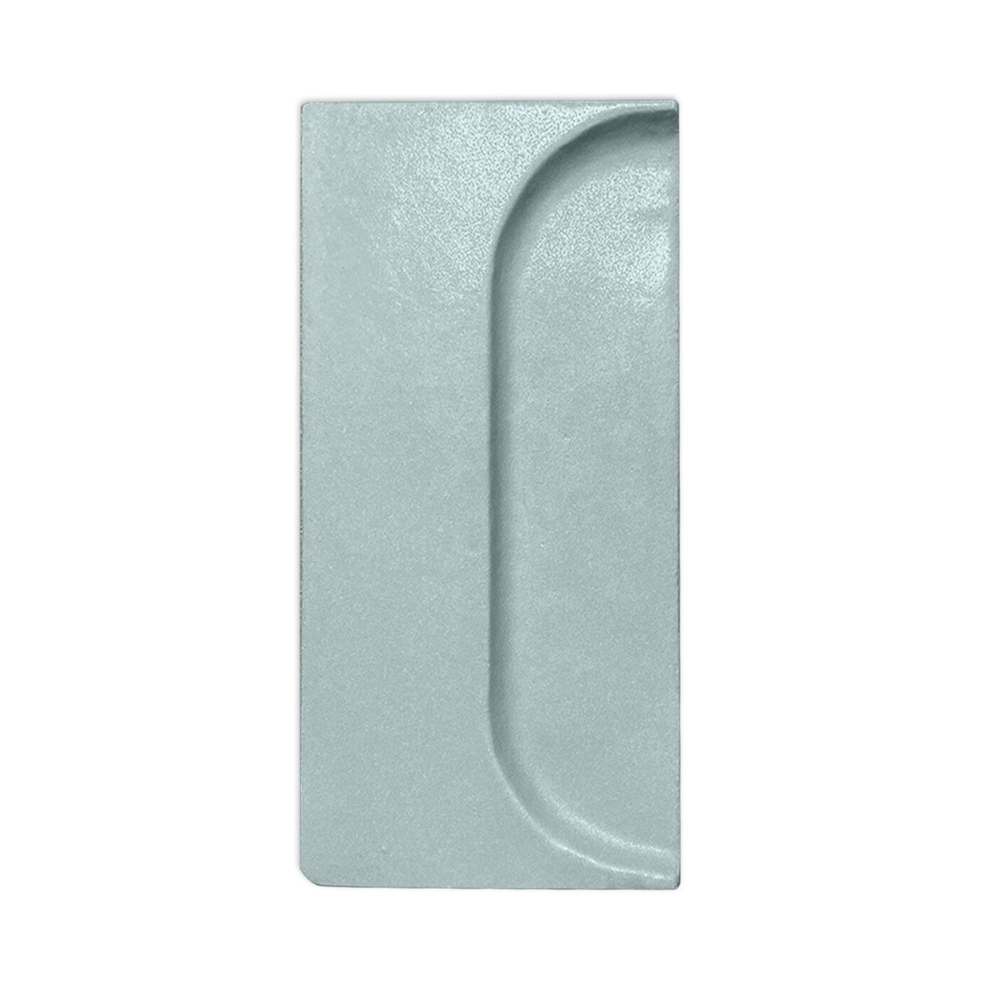 Gray textured sample by Clay Imports, rectangular with an oval spur indentation.