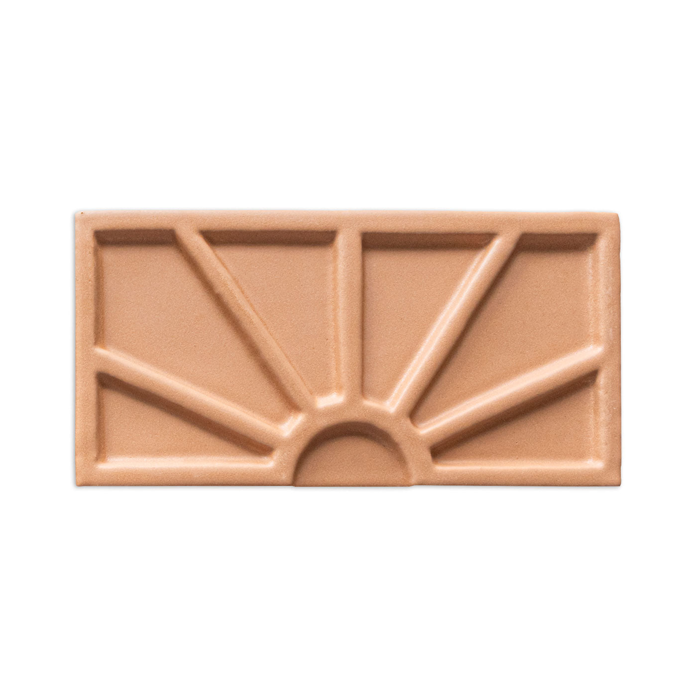 Terracotta-colored Petalito sample tile by Clay Imports with a raised geometric sunburst pattern.