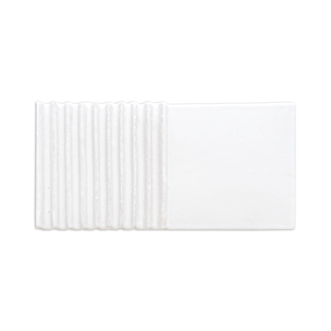 White Raya Chalk sample tile by Clay Imports with vertical ridges on the left and a smooth right side.
