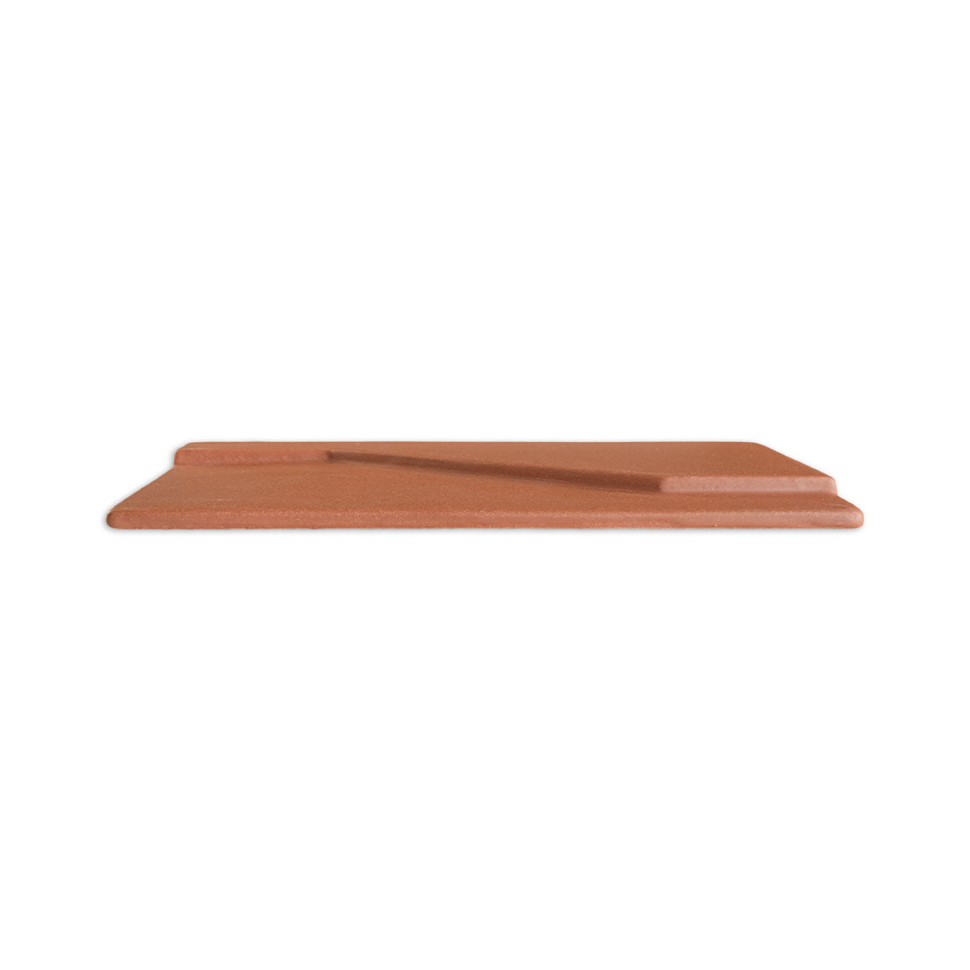 Rectangular reddish-brown Templo tile by Clay Imports, viewed from the side, with a stepped profile and recessed channel.