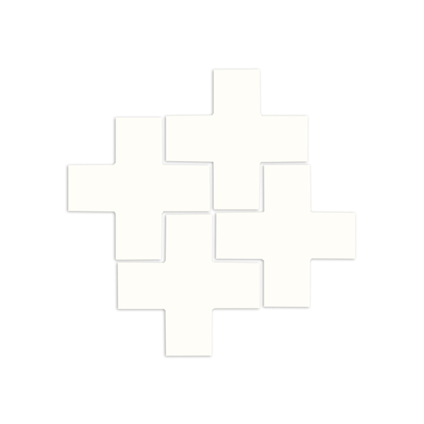 White cross-shaped tiles by Clay Imports arranged in an overlapping pattern with soft shadows.