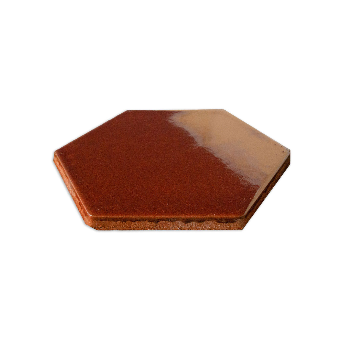 A reddish-brown hexagon solid tile by Clay Imports with a glossy finish and visible textured side.
