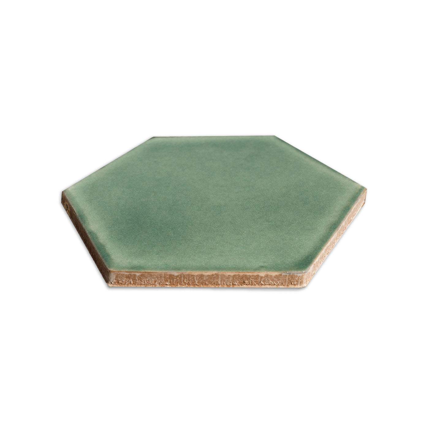 Green hexagon tile by Clay Imports, with a smooth surface and visible unglazed ceramic edge.