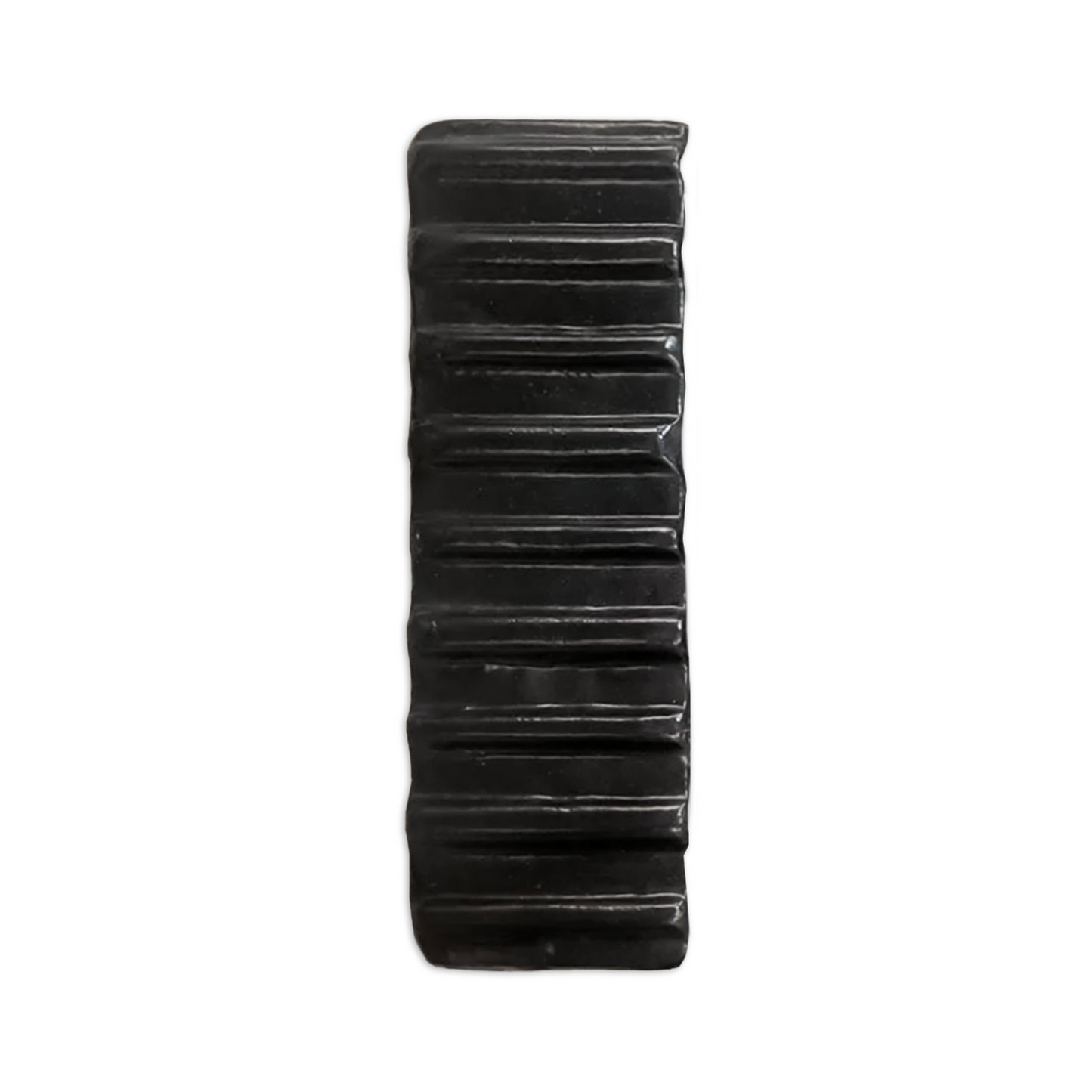Black glazed seersucker tile by Clay Imports with horizontal textured ridges.