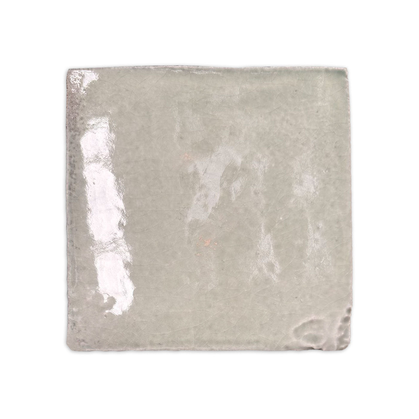 Glacier Zellige tile by Clay Imports, with a glossy, crackled grey-green surface and irregular edges.